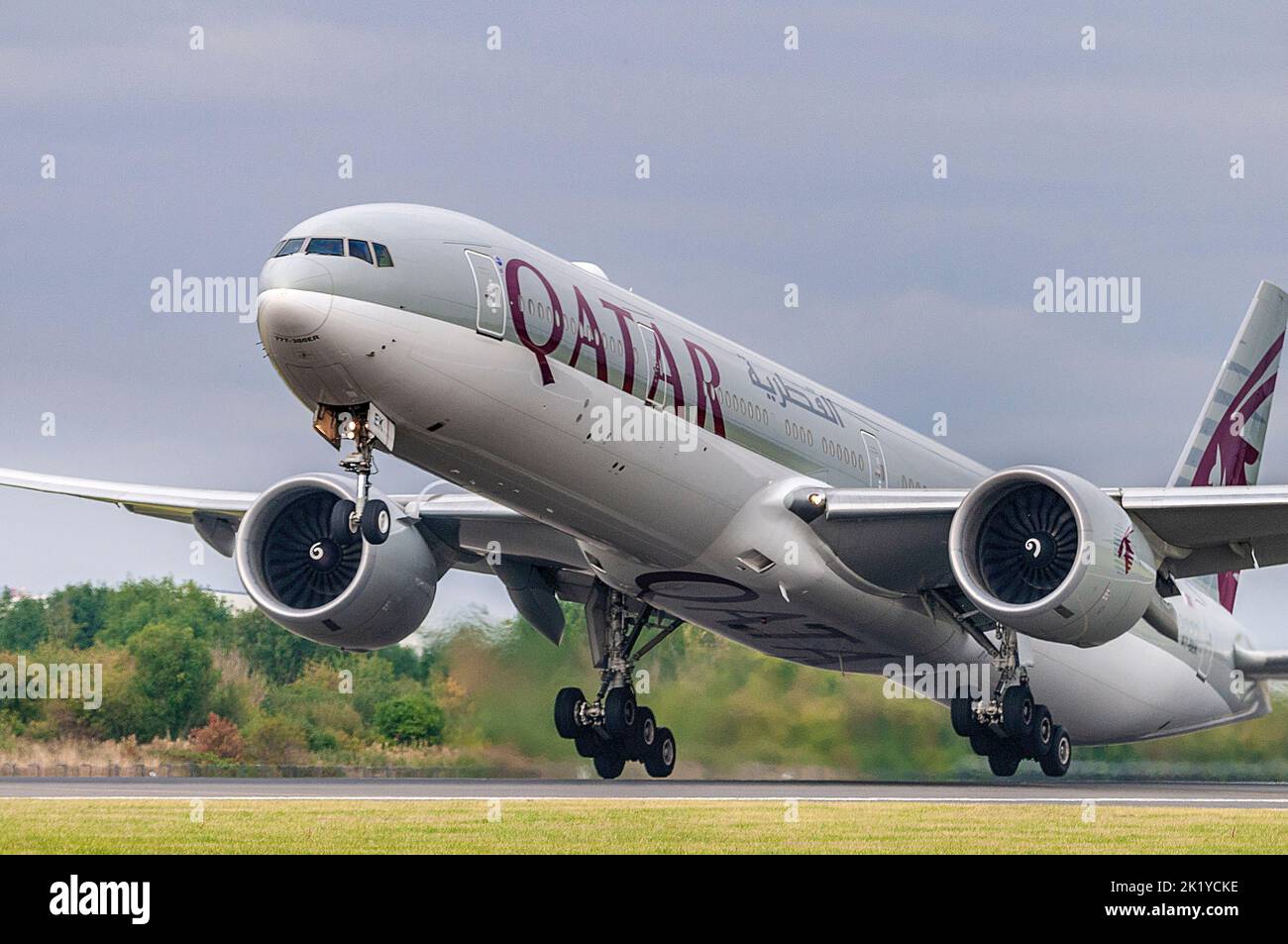 Qatar Airways Boeing 777-300/ER registration A7-BEK takes off at Manchester airport. Stock Photo