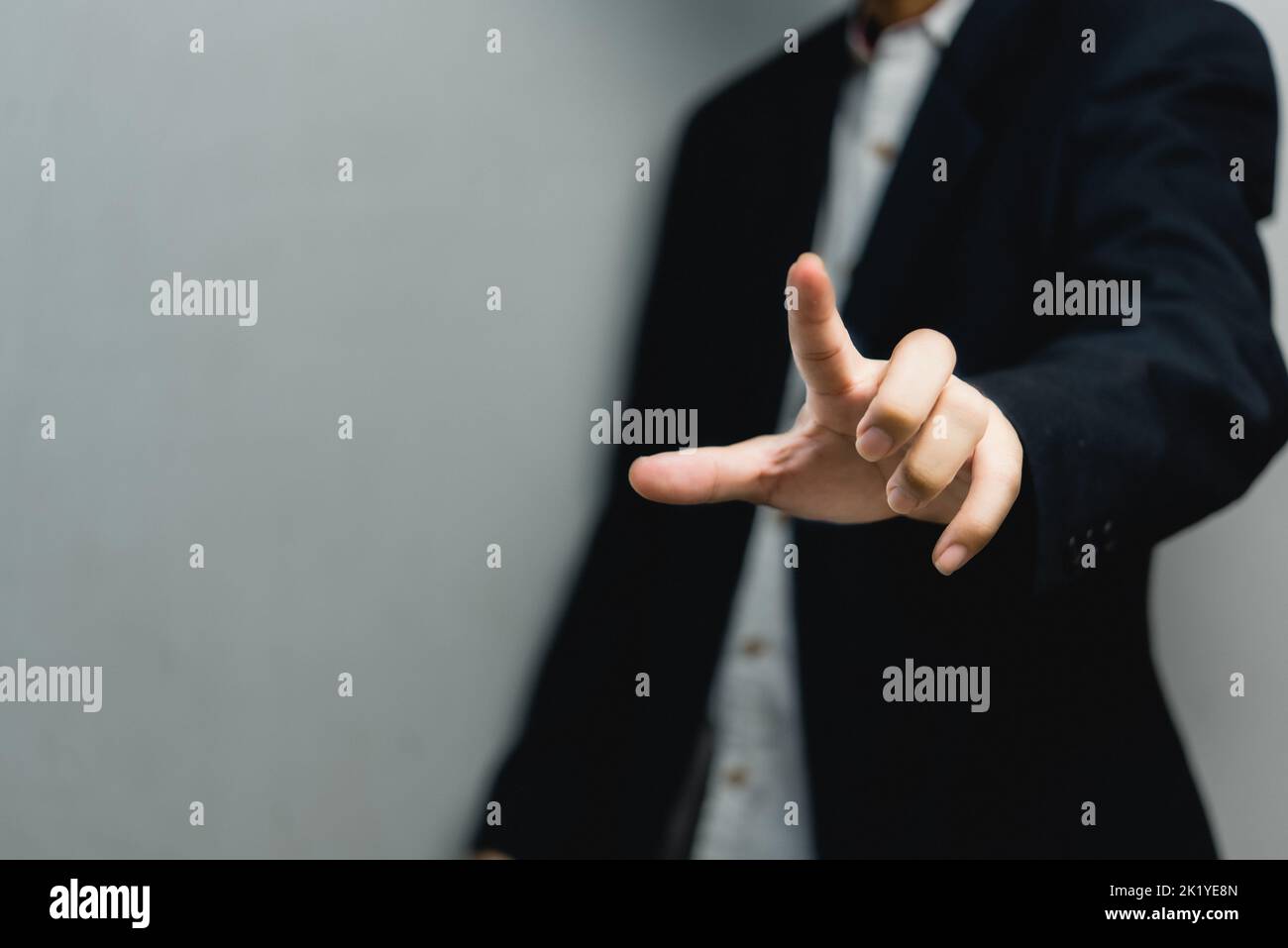 Businessman pressing button on virtual screen.copy Space for text. Stock Photo