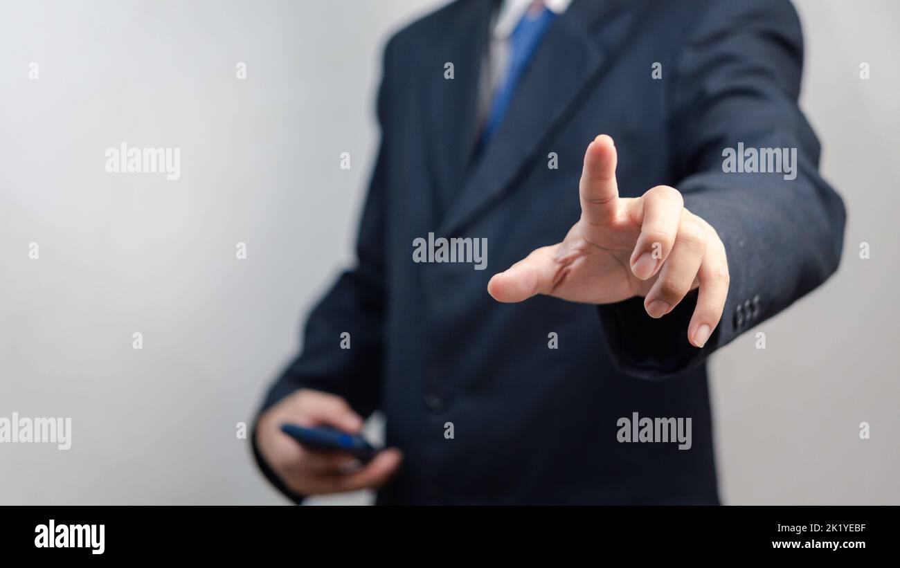 Businessman pressing button on virtual screen.copy Space for text. Stock Photo