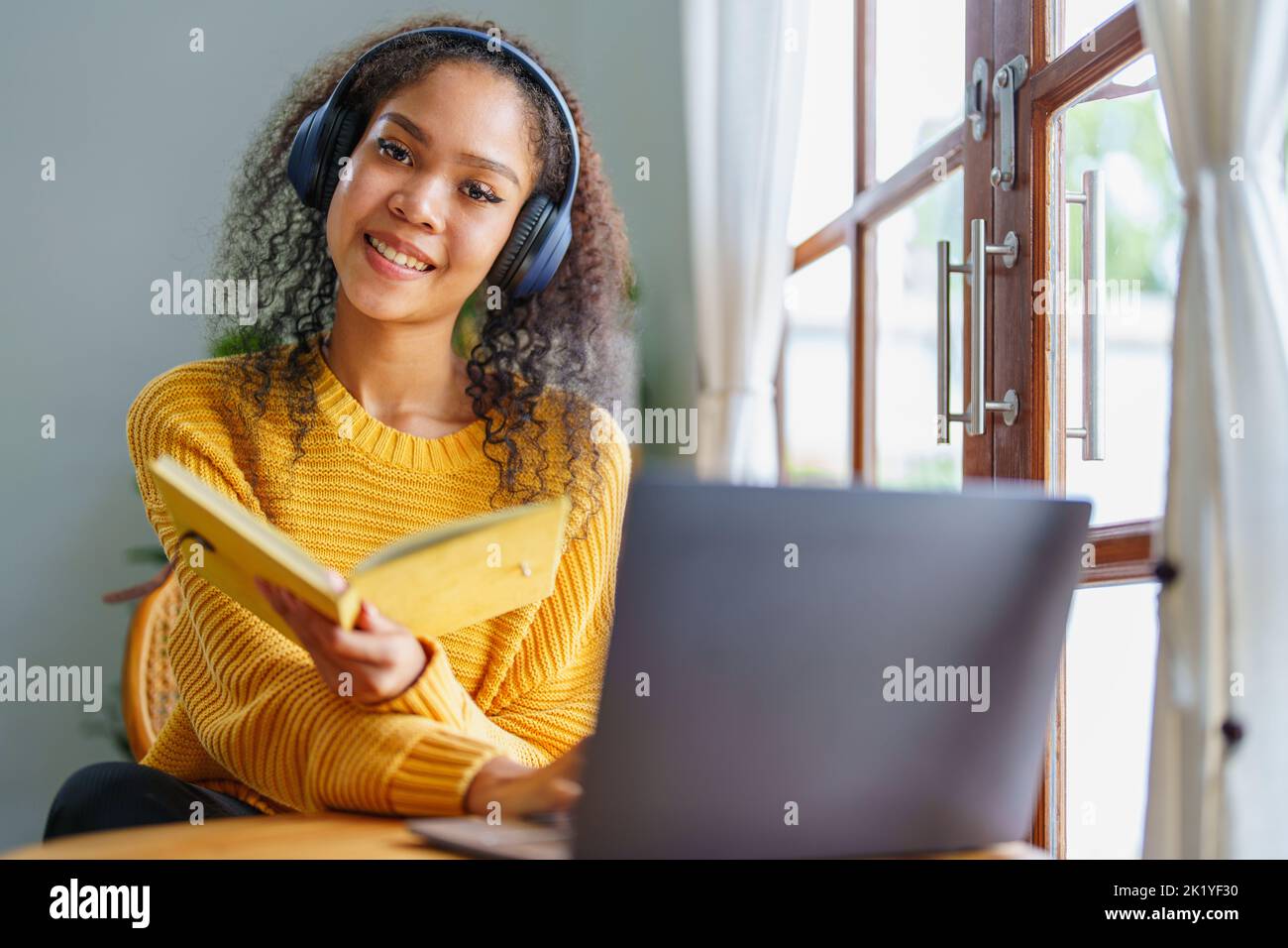 African Americans using notebooks, pens to take notes and computers ...