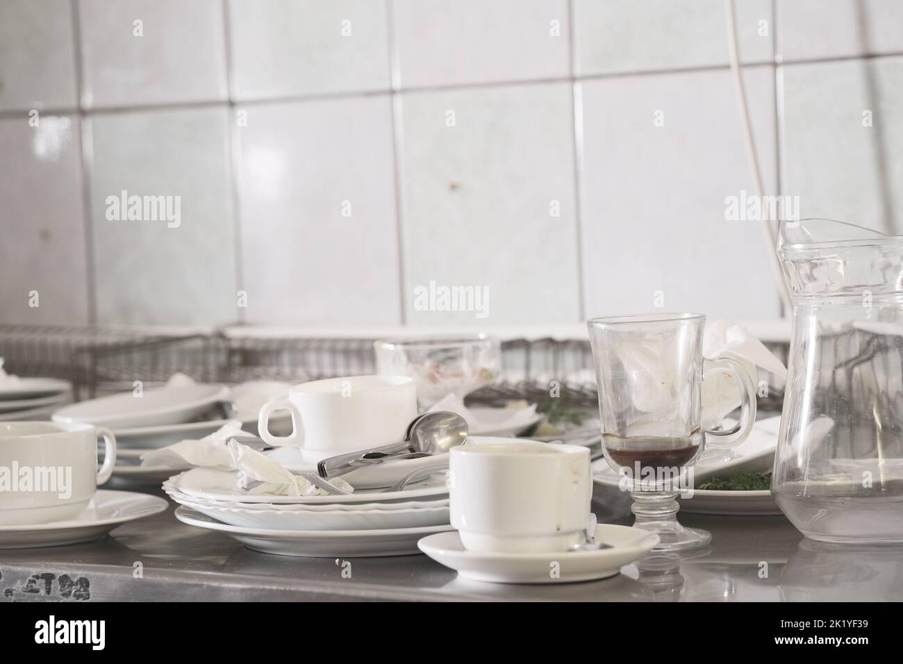 Dirty dishware on metal table. Stock Photo
