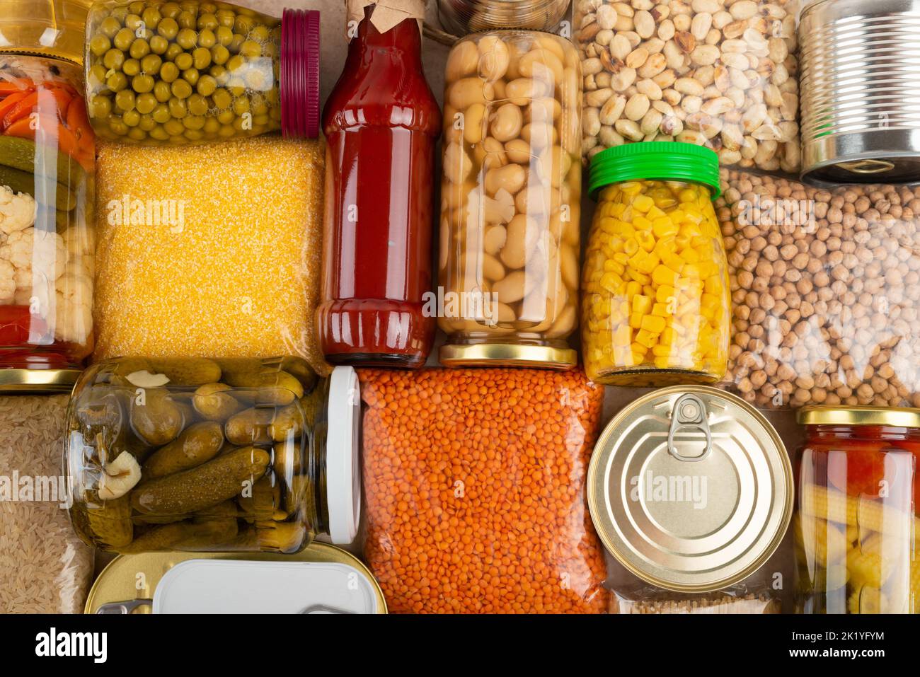Emergency survival groceries on kitchen table closeup flat lay Stock Photo