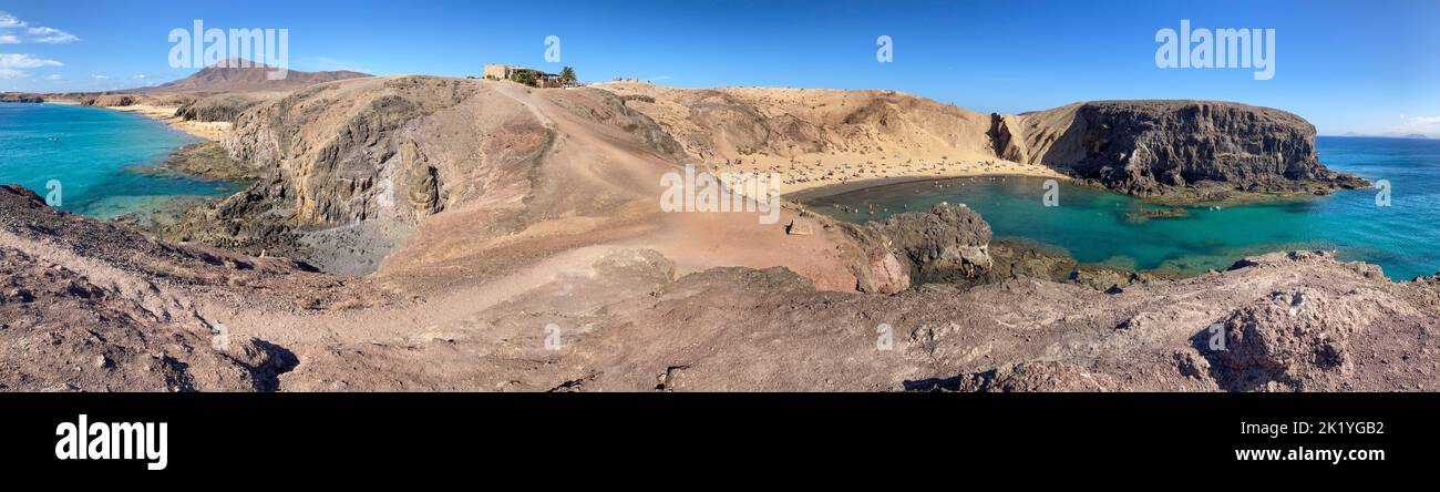Panoramic image of the beaches Playa de la Cera (left) and Playa de Papagayo (right) on the island of Lanzarote, Spain. Stock Photo