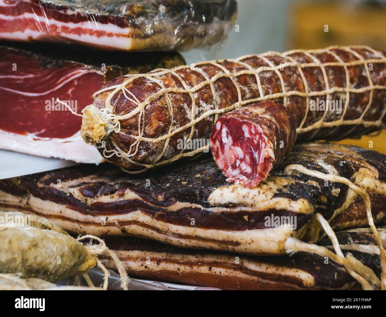 food counter, selling Italian cured meats. Italian salami close up Stock Photo