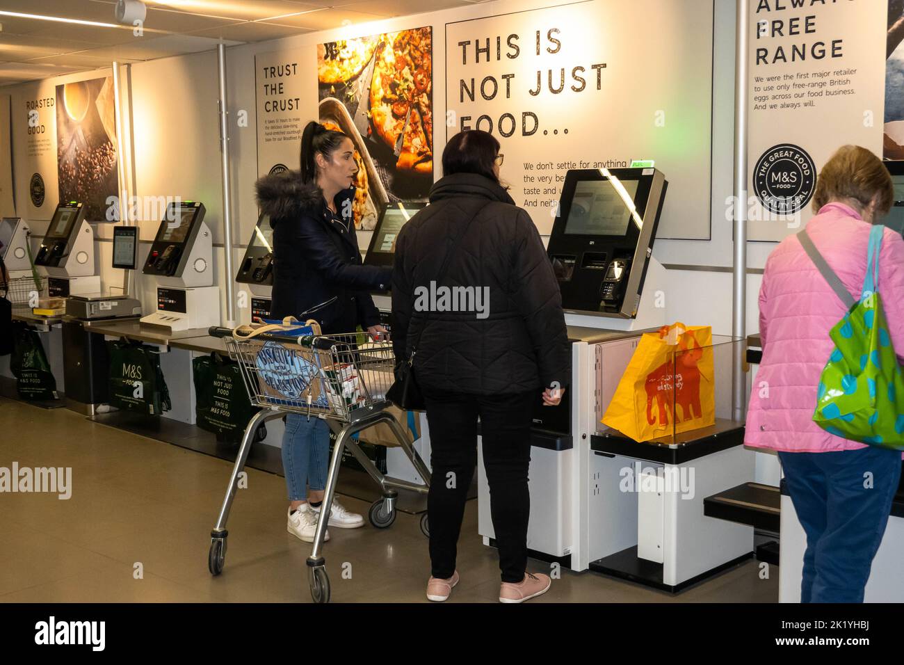 Lady shoppers paying for there goods at a self service Marks and Spencers superstore in Norwich Norfolk Stock Photo