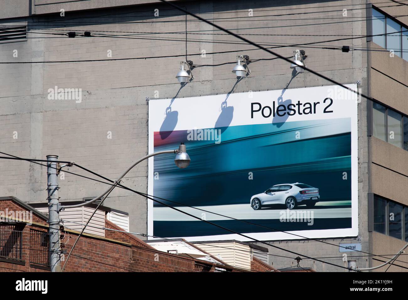 A Polestar 2 advertisement billboard is seen on a building in downtown Toronto; Polestar is a growing electric vehicle manufacturer owned by Volvo. Stock Photo