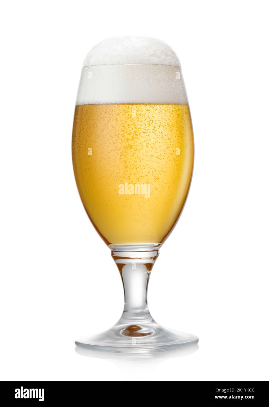 Glass of lager draught craft ipa premium beer with foam on white. Stock Photo