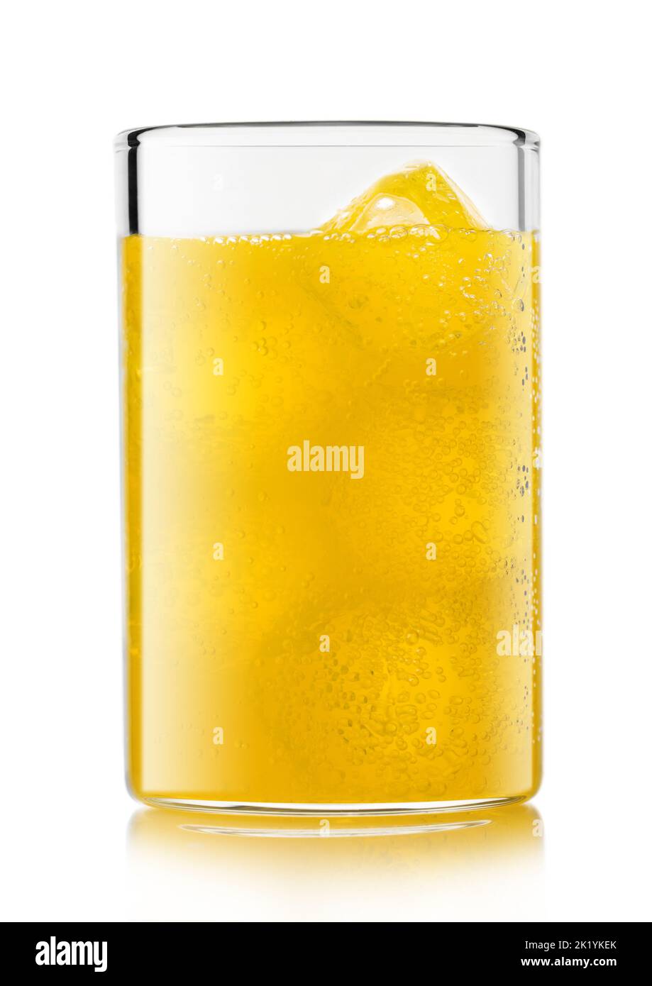 Orange soda drink with ice cubes and bubbles on white. Stock Photo