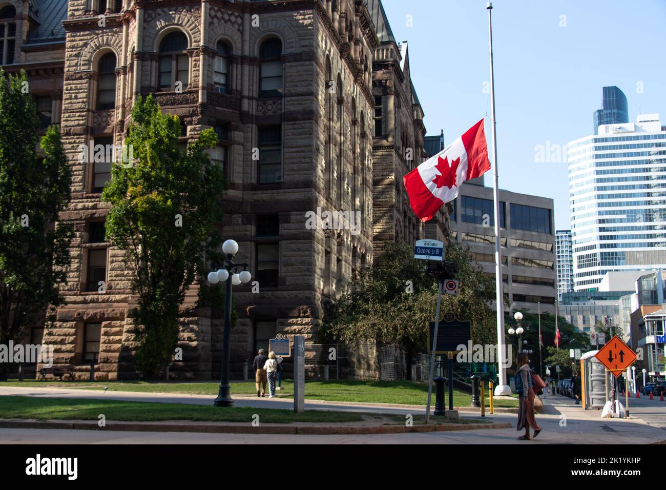 A Canadian flag at half mast or half staff in downtown Toronto at the