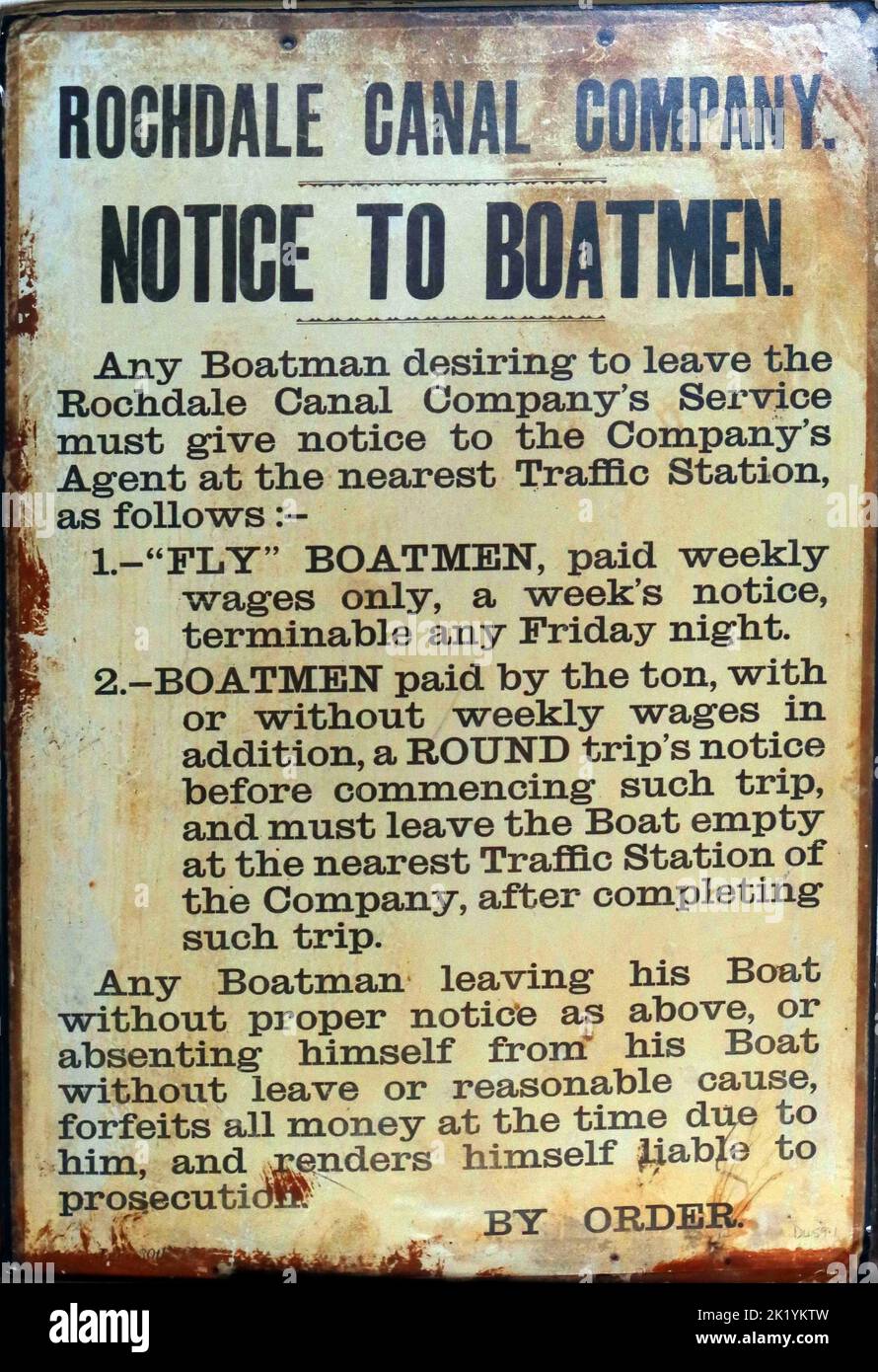 Metal enamel sign, Rochdale Canal Company, Notice To Boatmen sign, labour regulations, giving notice rules by order & liable for prosecution Stock Photo