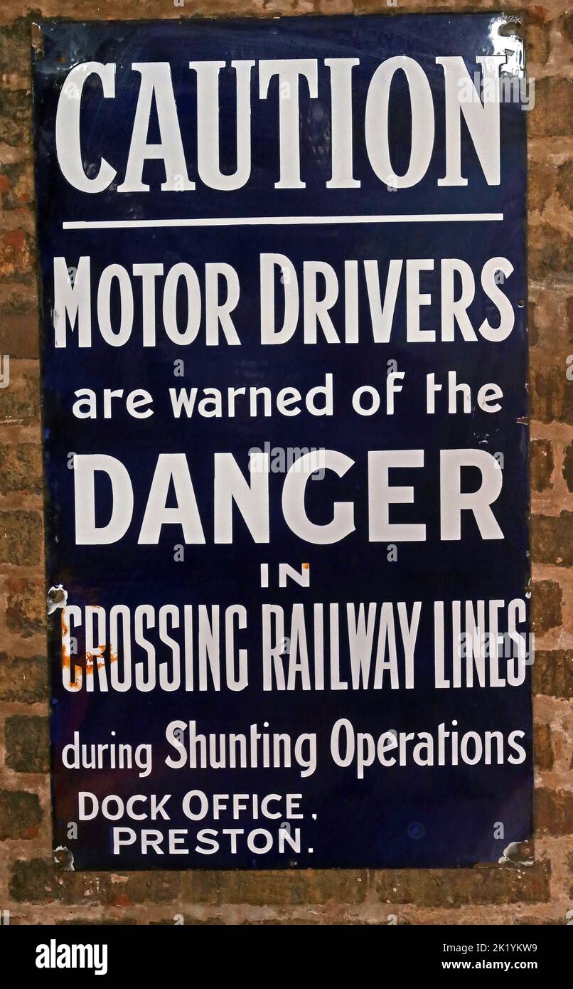 Caution, Motor Drivers, are warned of the, Danger, in, Crossing Railway lines, during shunting operations, dock office, Preston Stock Photo
