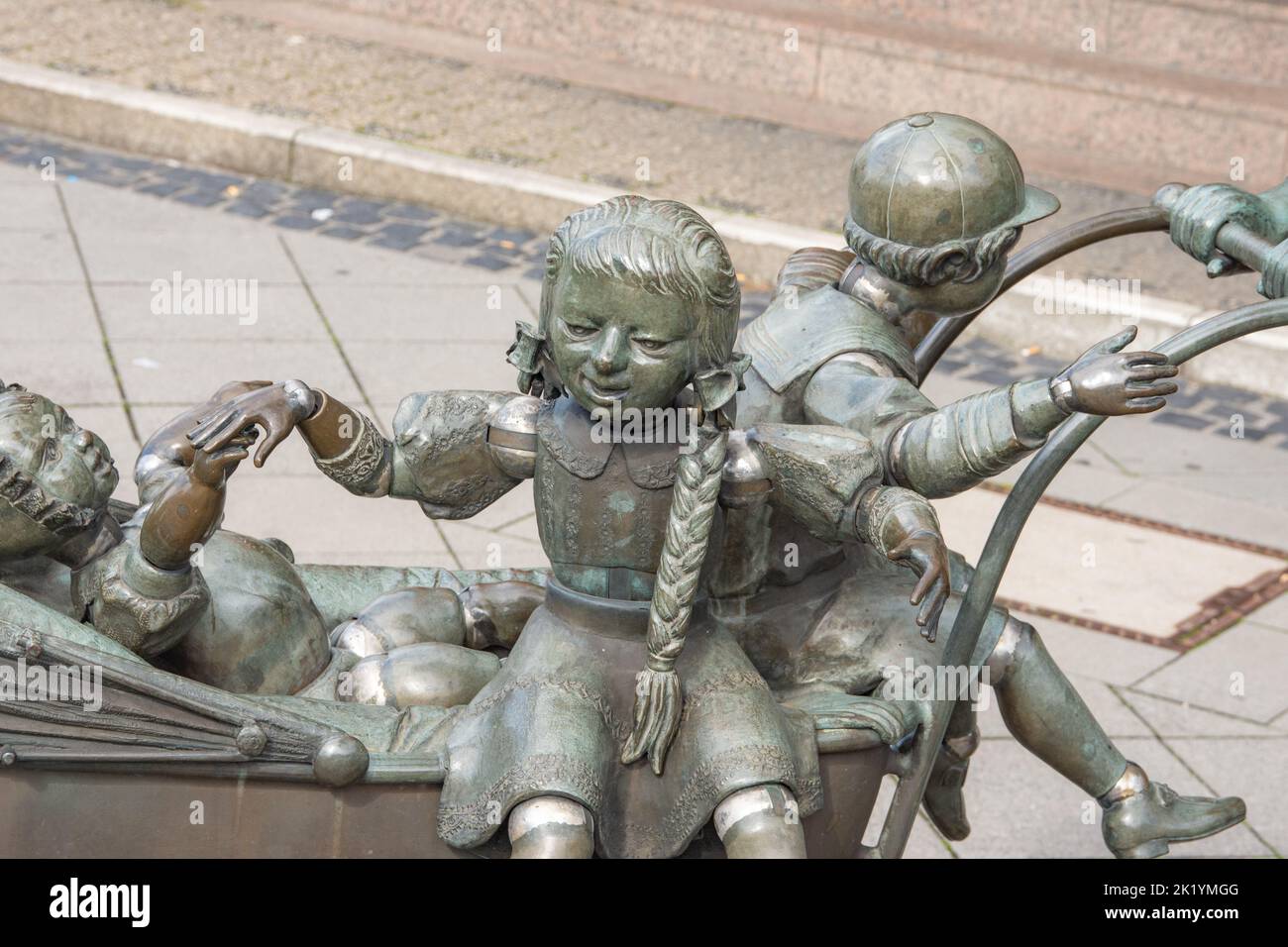 Aachen April 2021: A beautiful sculpture in the Aachen-Brand district. with child and cone. From bronze sculpture is the Aachen Bonifatius Stirnberg Stock Photo