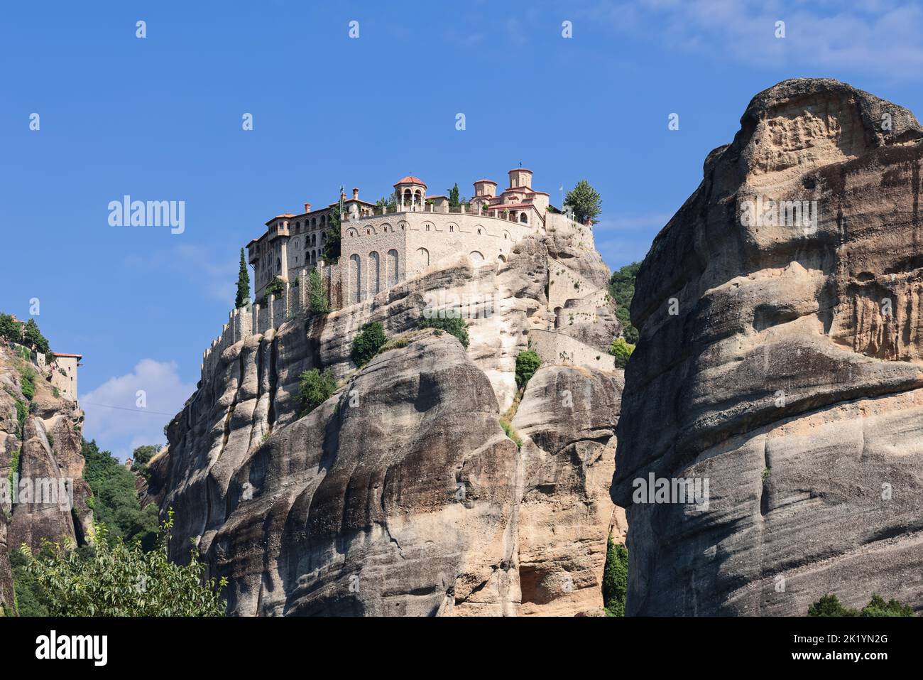 Rising high above the Thessalian plain, the sandstone megalith on which the Varlaam monastery was built, reaches a height of 370 m - almost halfway Stock Photo