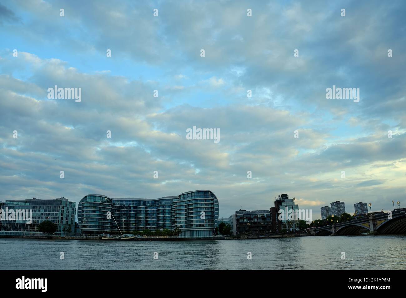 View of the Albion Riverside development on the River Thames from the north side of the river at dusk Stock Photo