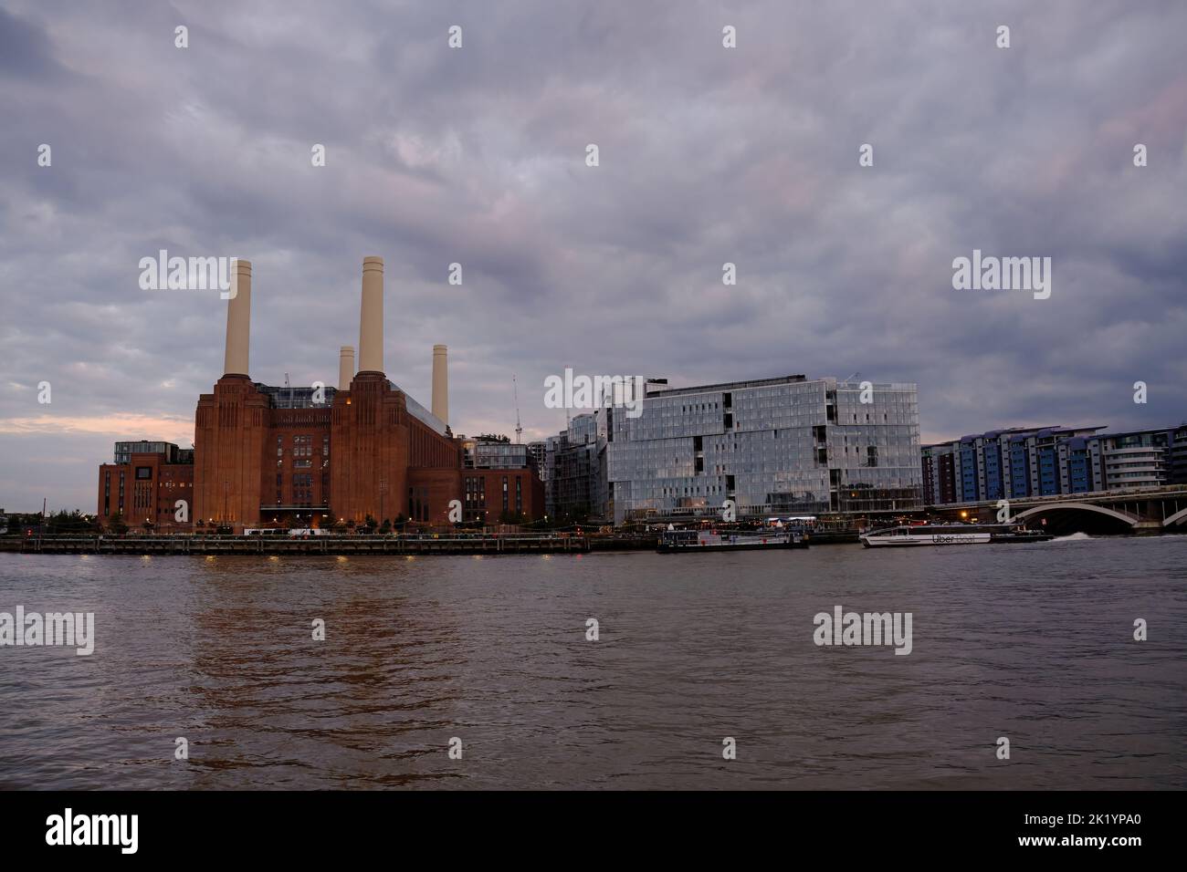 View of Battersea Power Station from the north side of the River Thames in London at dusk Stock Photo