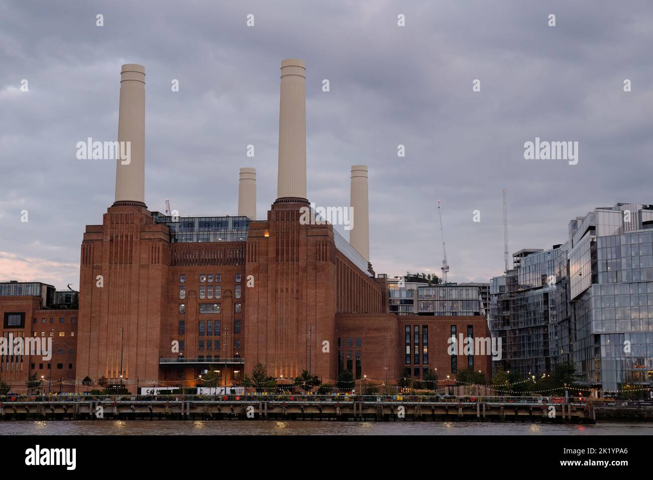 View of Battersea Power Station from the north side of the River Thames in London at dusk Stock Photo