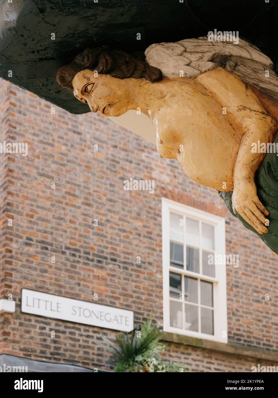 17th century carved ship mermaid figurehead on building in Stonegate,York, North Yorkshire, England, UK Stock Photo