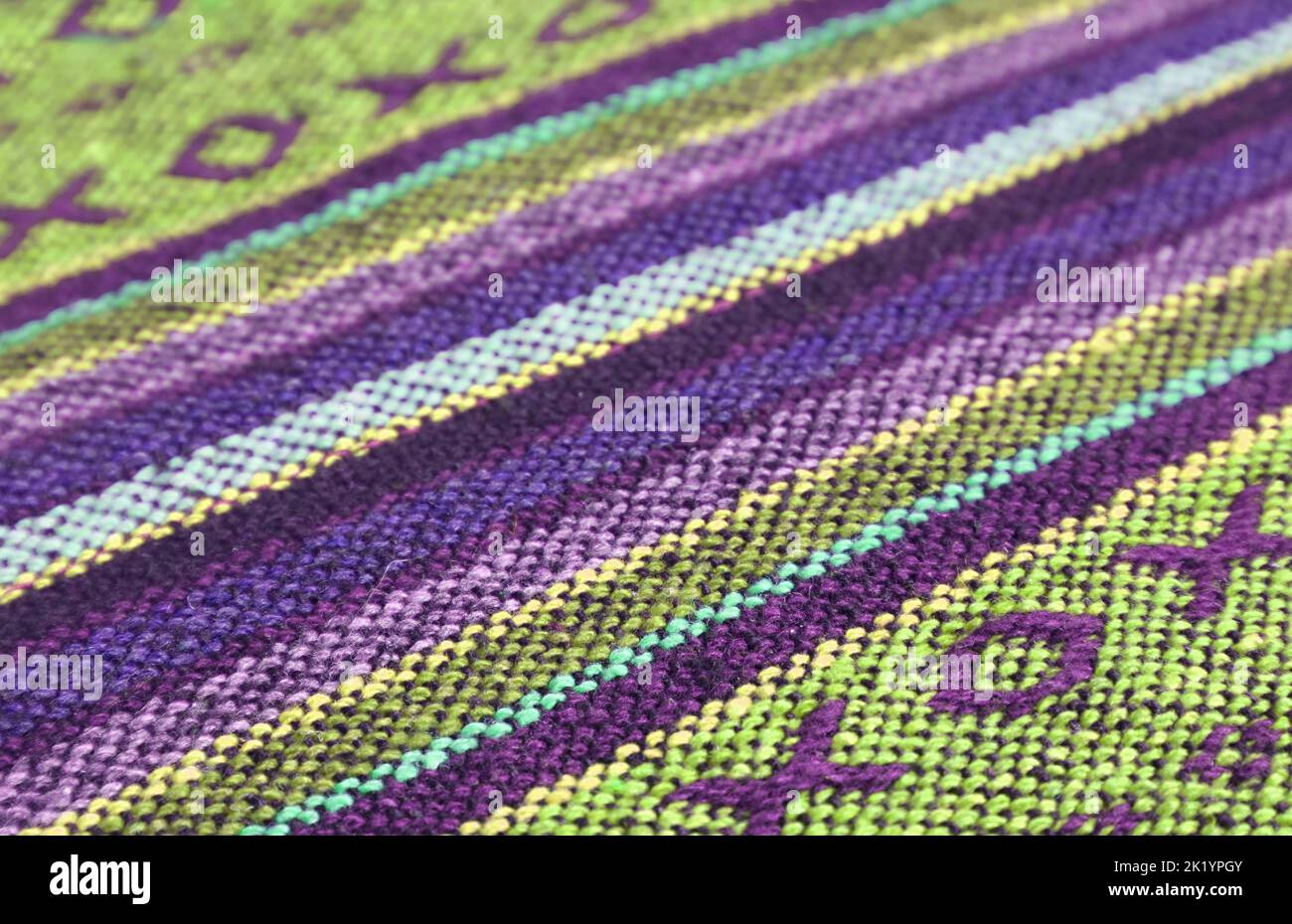 Closeup Pattern and Texture of Purple and Lime Green Thai Northern Region's Traditional Textile Stock Photo