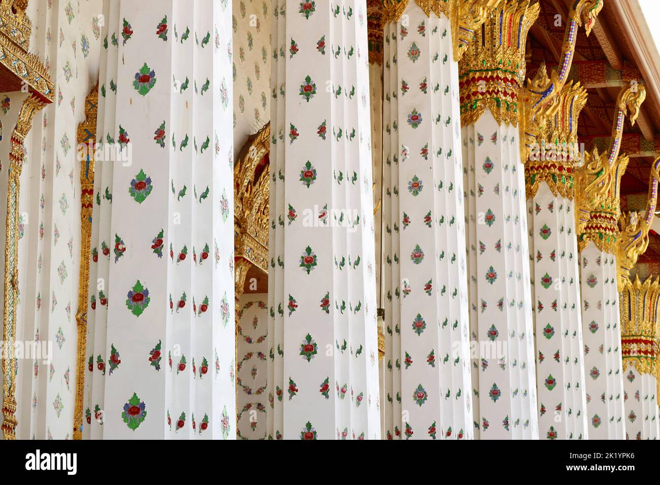 Gorgeous Columns of the Ordination Hall of Wat Arun Encrusted with Beautiful Glazed Ceramic Floral Patterns, Bangkok, Thailand Stock Photo