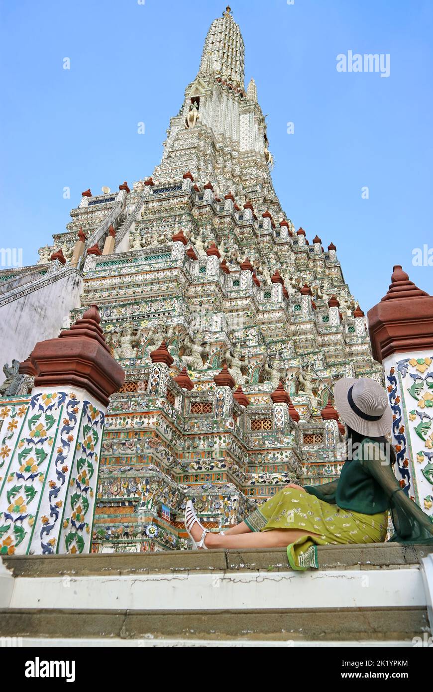 Female Visitor Being Impressed by Phraprang, the Central Spire of Wat Arun, One of the Iconic Landmarks of Bangkok, Thailand Stock Photo