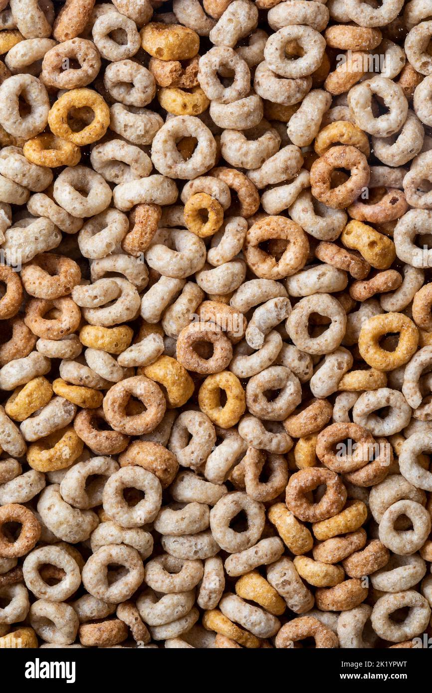 closeup of breakfast cereal hoops in a clear plastic container with sugar granules Stock Photo