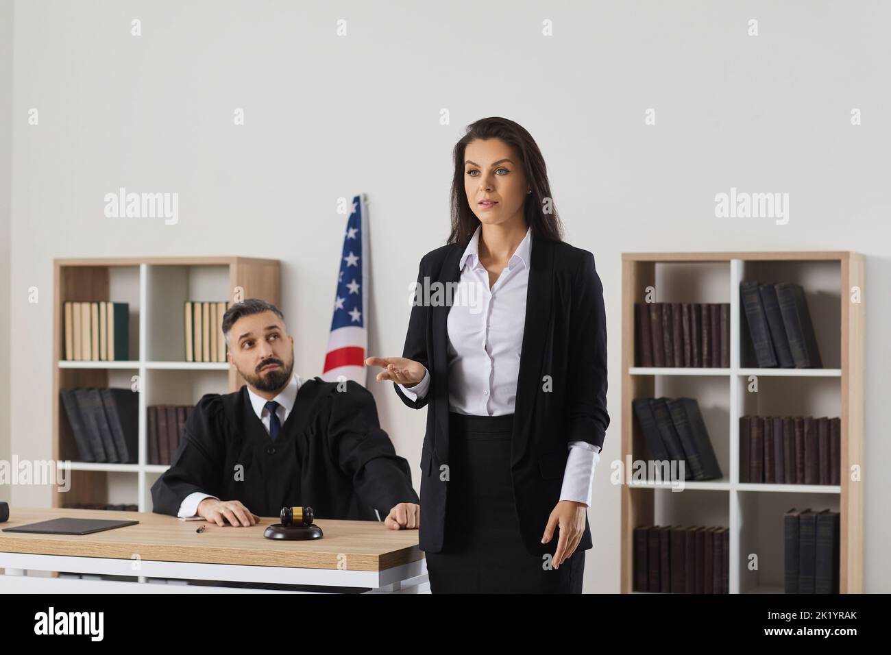 Female lawyer speak to public in courthouse Stock Photo