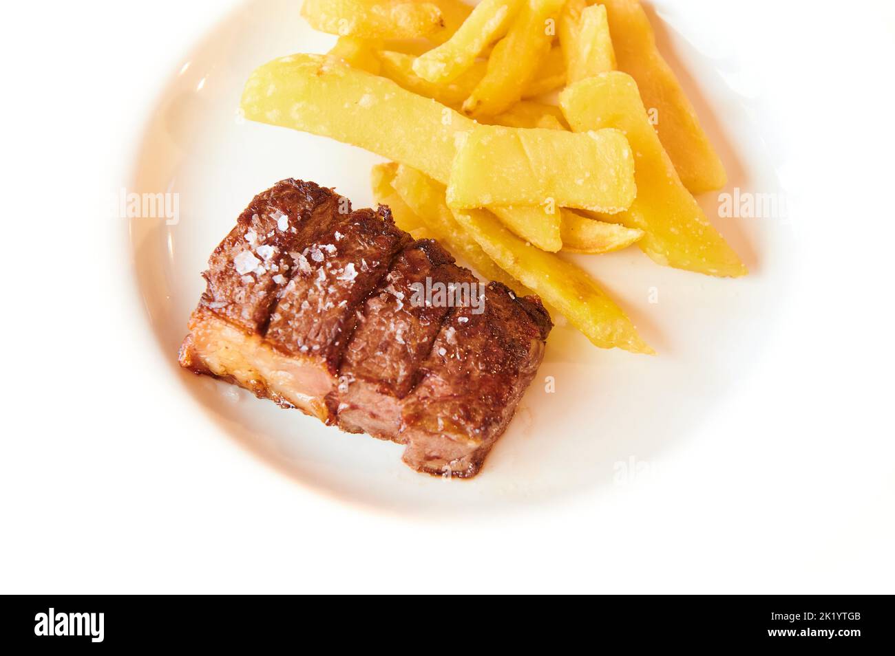 Sirloin steak with potatoes Stock Photo