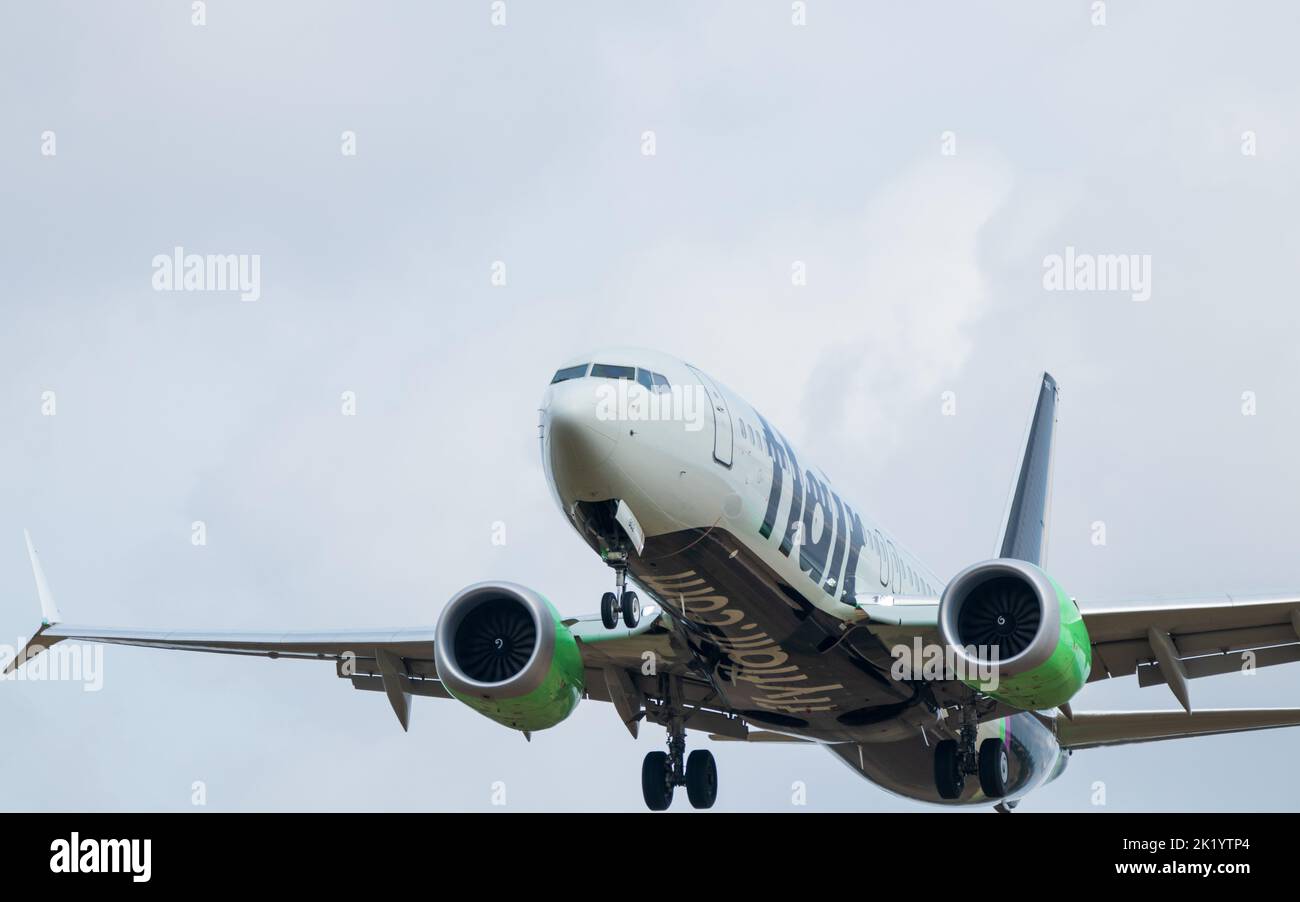 A Flair Airlines Boeing 737MAX is seen landing on a cloudy day at