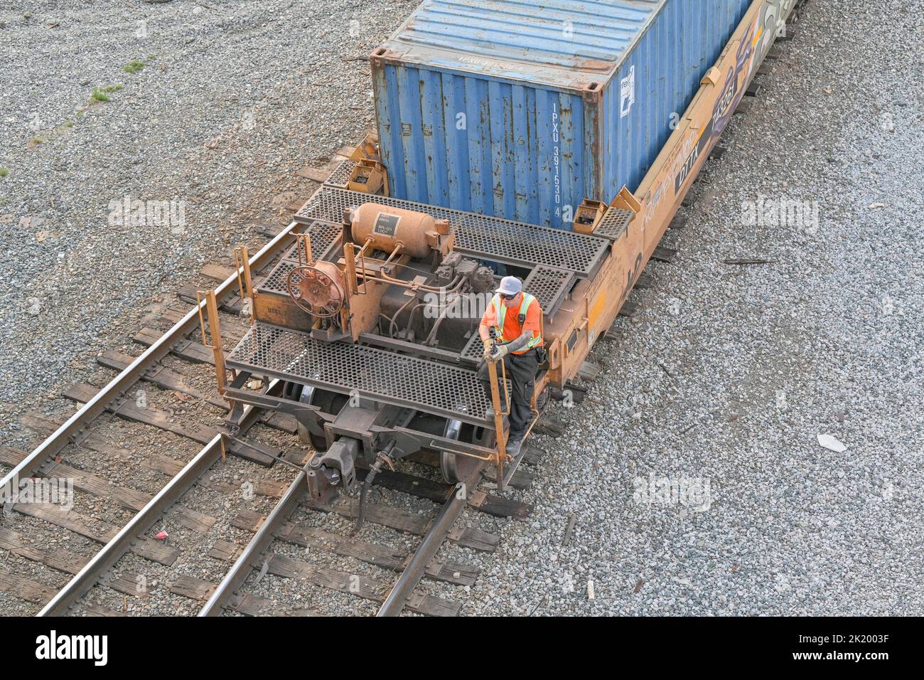 Railway worker moving container  in freight yard, Vancouver, British Columbia, Canada Stock Photo