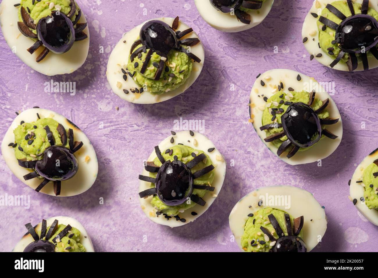 Deviled eggs with avocado. Spider for Halloween party Stock Photo