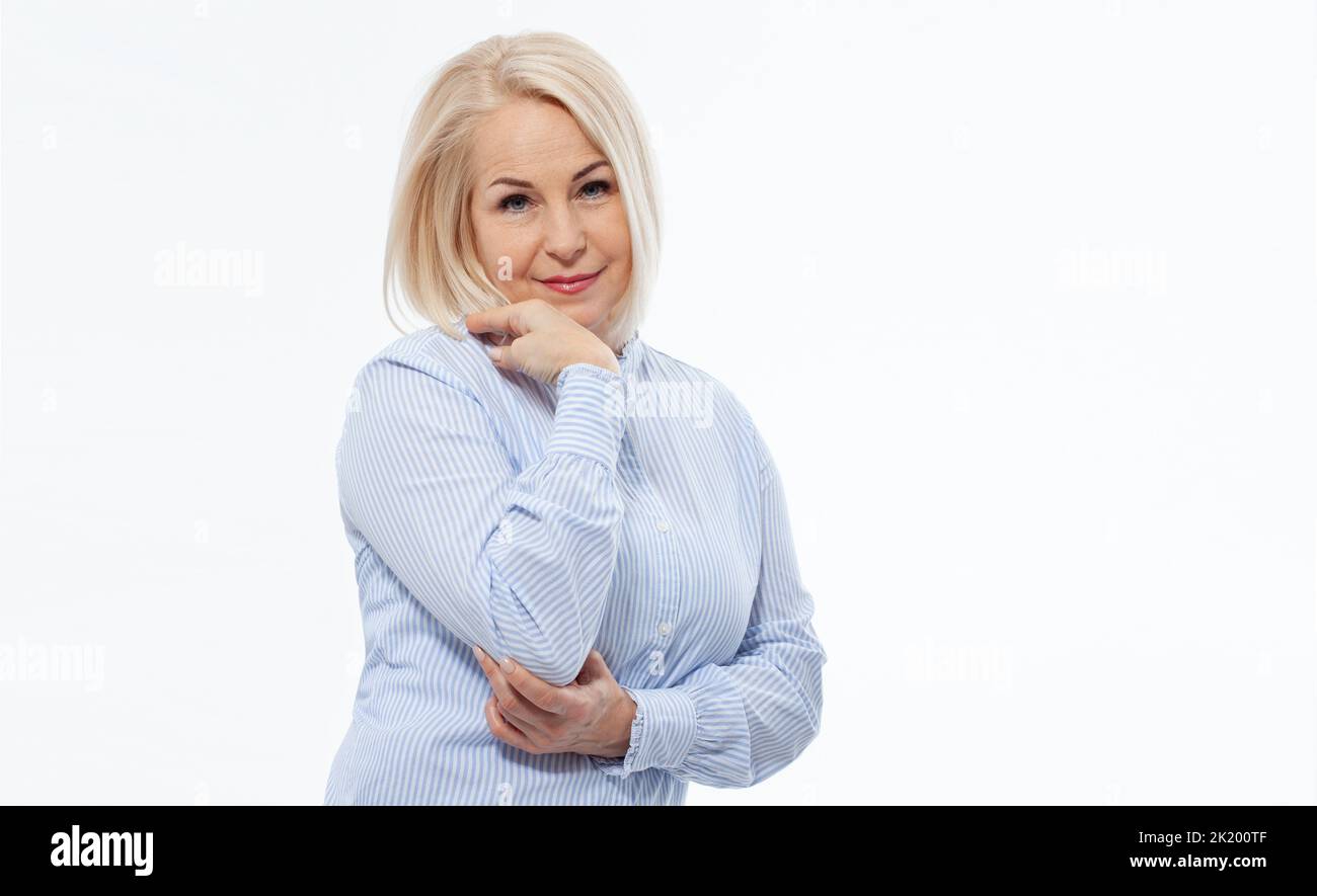 Attractive middle aged woman with folded arms on white background Stock Photo