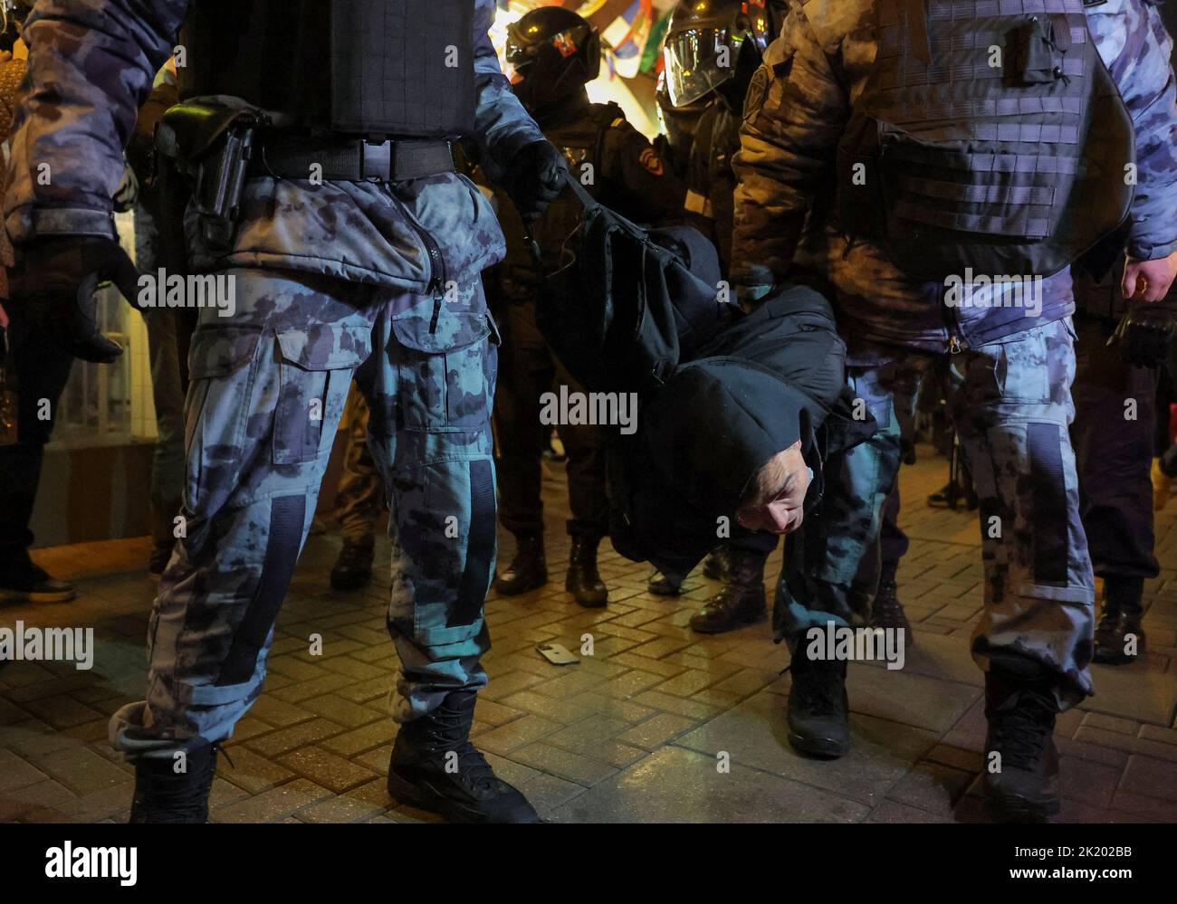 Russian police officers detain a person during an unsanctioned rally, after opposition activists called for street protests against the mobilisation of reservists ordered by President Vladimir Putin, in Moscow, Russia September 21, 2022. REUTERS/REUTERS PHOTOGRAPHER Stock Photo