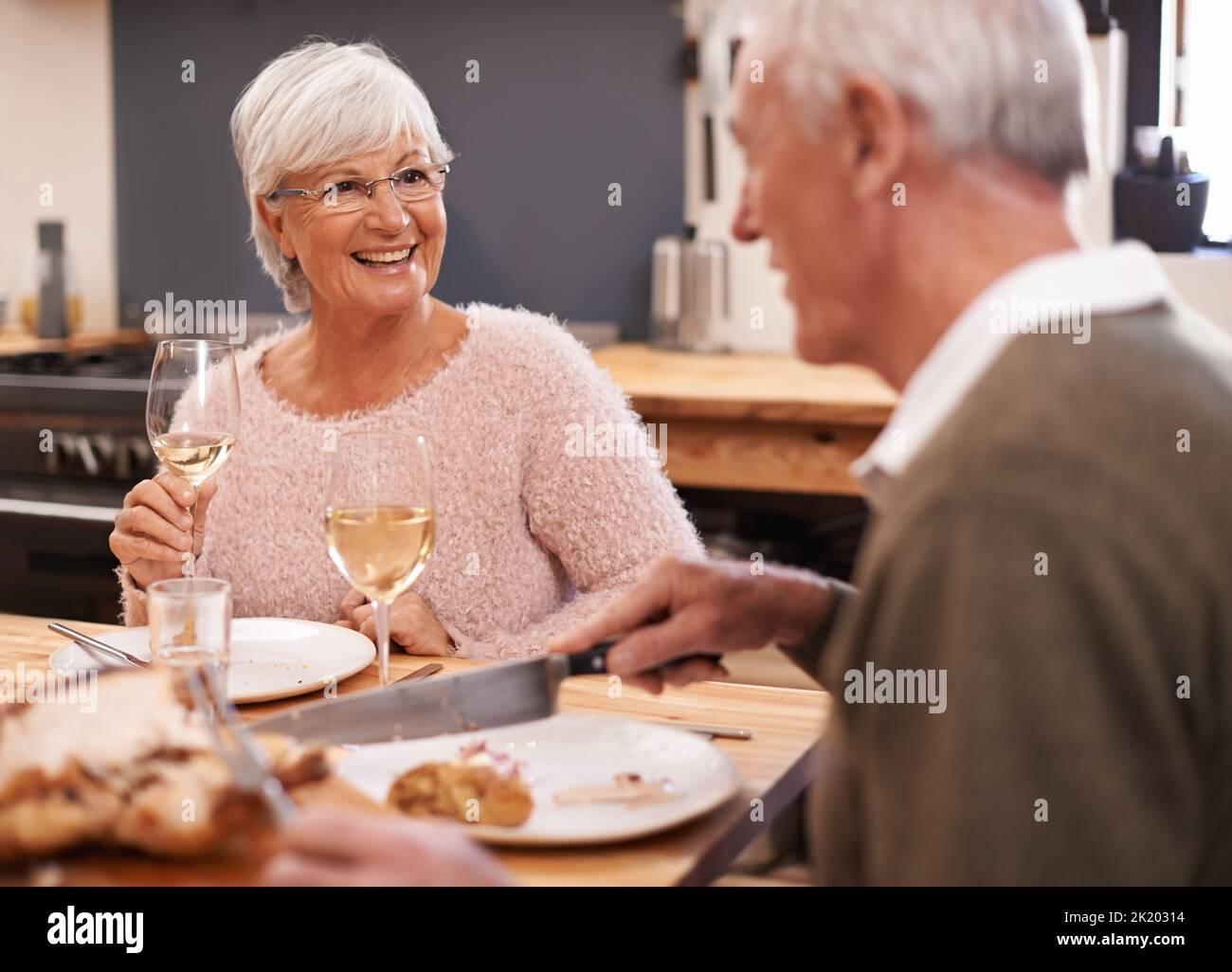 Wine makes every day better. a mature couple having a glass of wine with dinner. Stock Photo