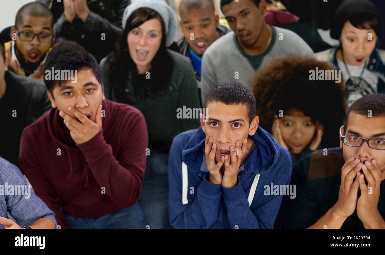 The shock and horror. Portrait of shocked young people looking up at the camera. Stock Photo