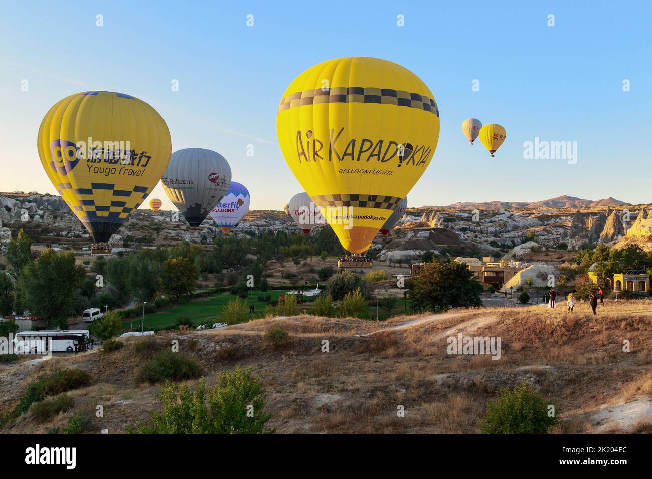 GOREME, TURKEY - OCTOBER 4, 2020: This is a flight of balloons at low altitude from the surface of the earth in Cappadocia. Stock Photo