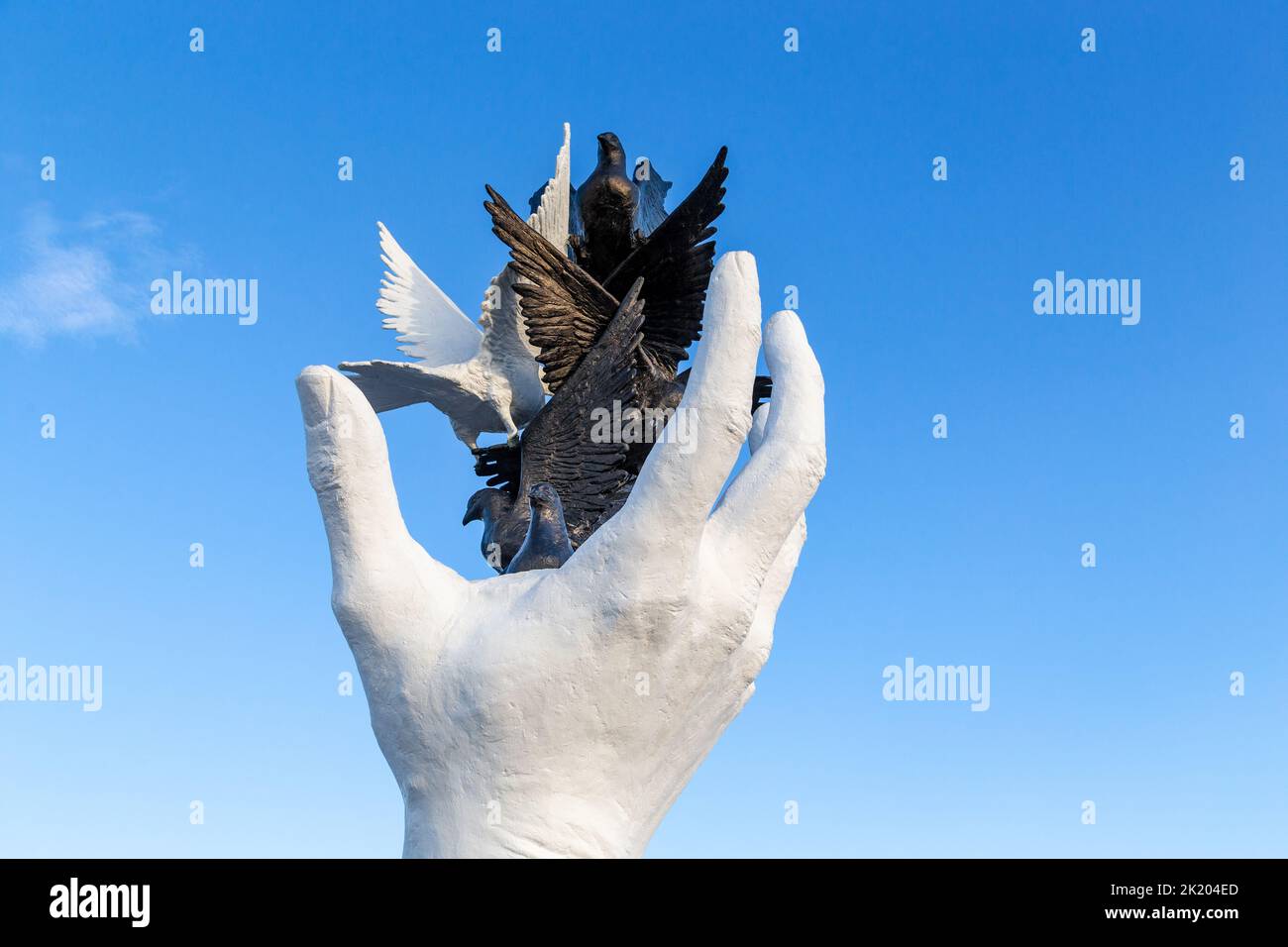 KUSADASI, TURKEY - JUNE 2, 2021: This is a fragment of the Hand of Peace monument on the embankment of the city. Stock Photo