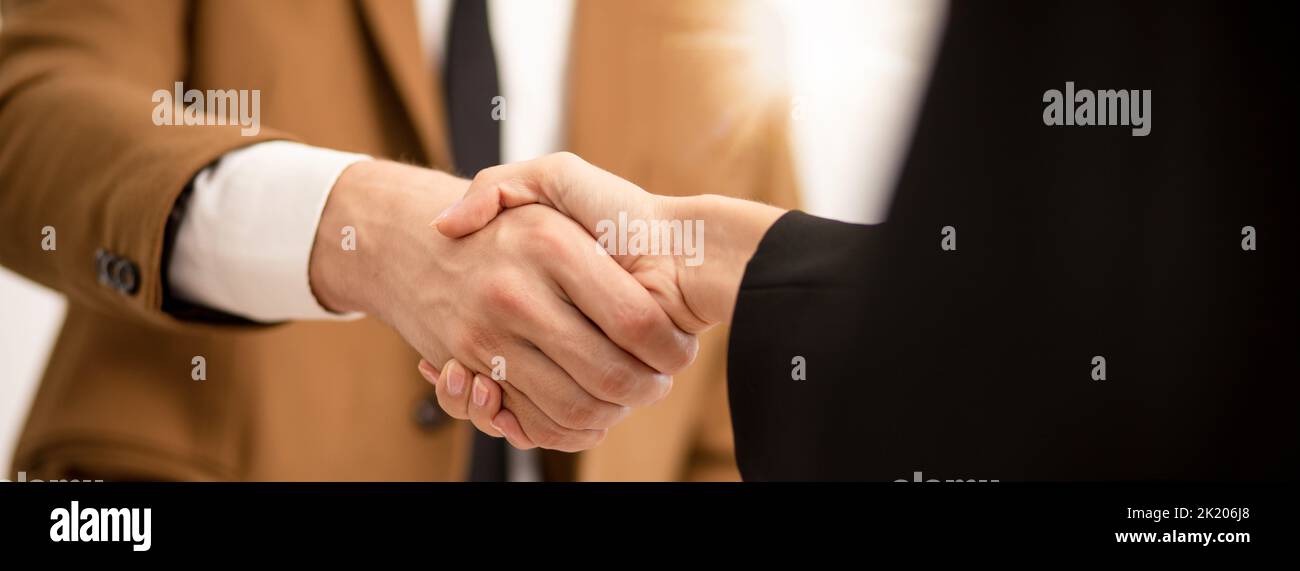 Business man hands shaking ,Successful businessman handshake after good deal for both companies businessmen handshaking after finishing up meeting Stock Photo
