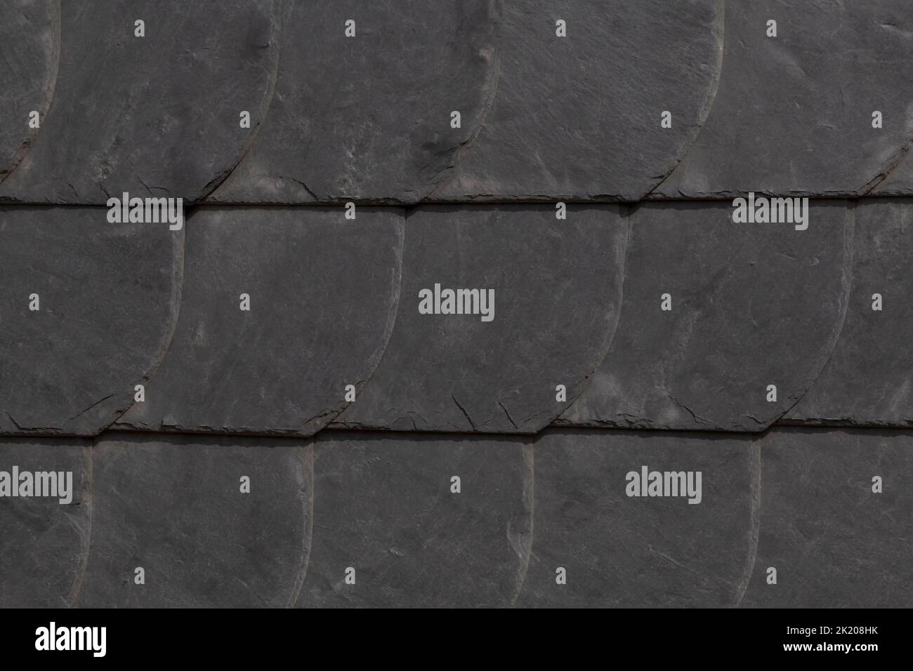 close up of black clay roof tiles on roof of house in Germany Stock Photo