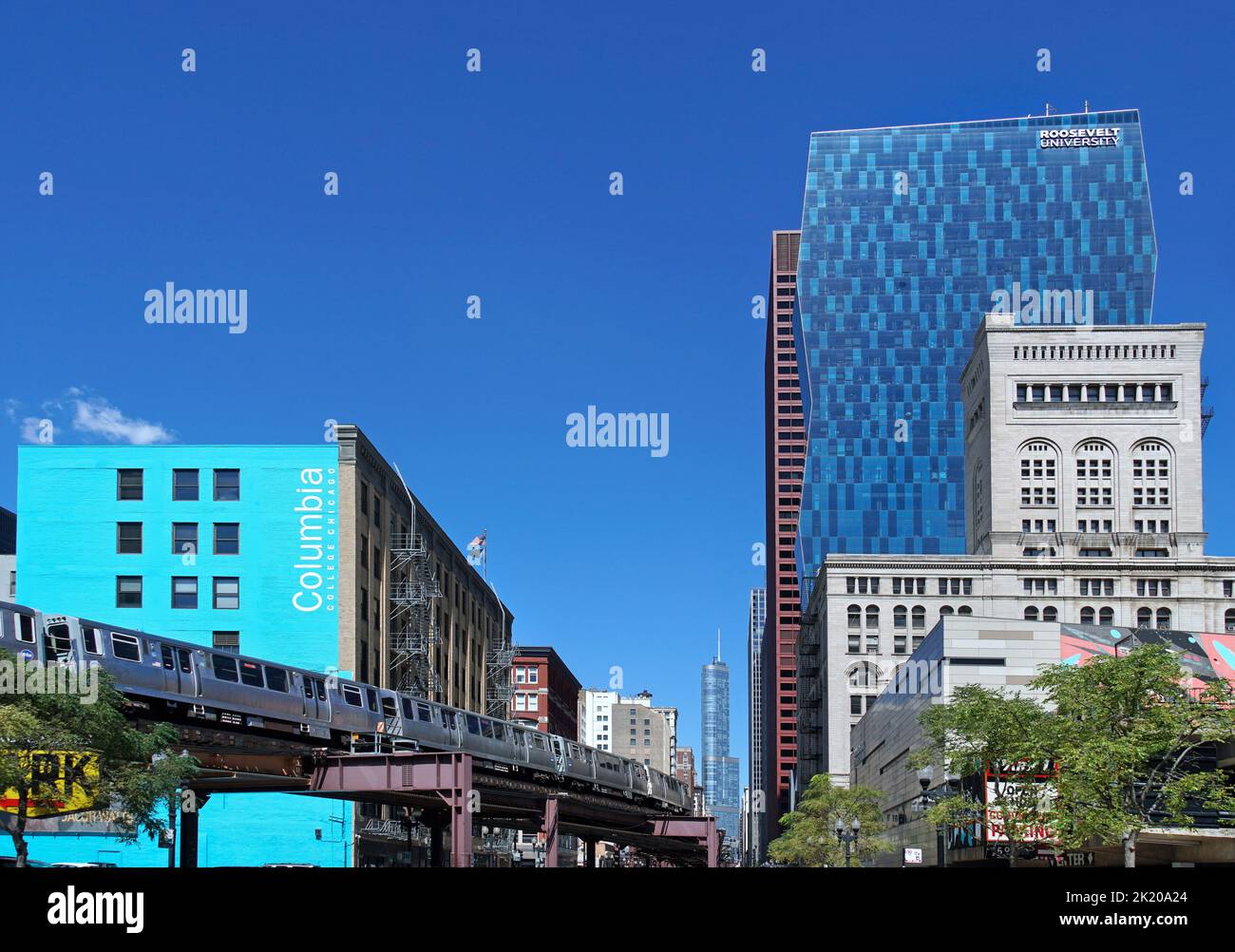 Chicago, USA - August 2022:  Looking north on Wabash Avenue, with the Loop elevated commuter train and the new high rise building of Roosevelt Univers Stock Photo