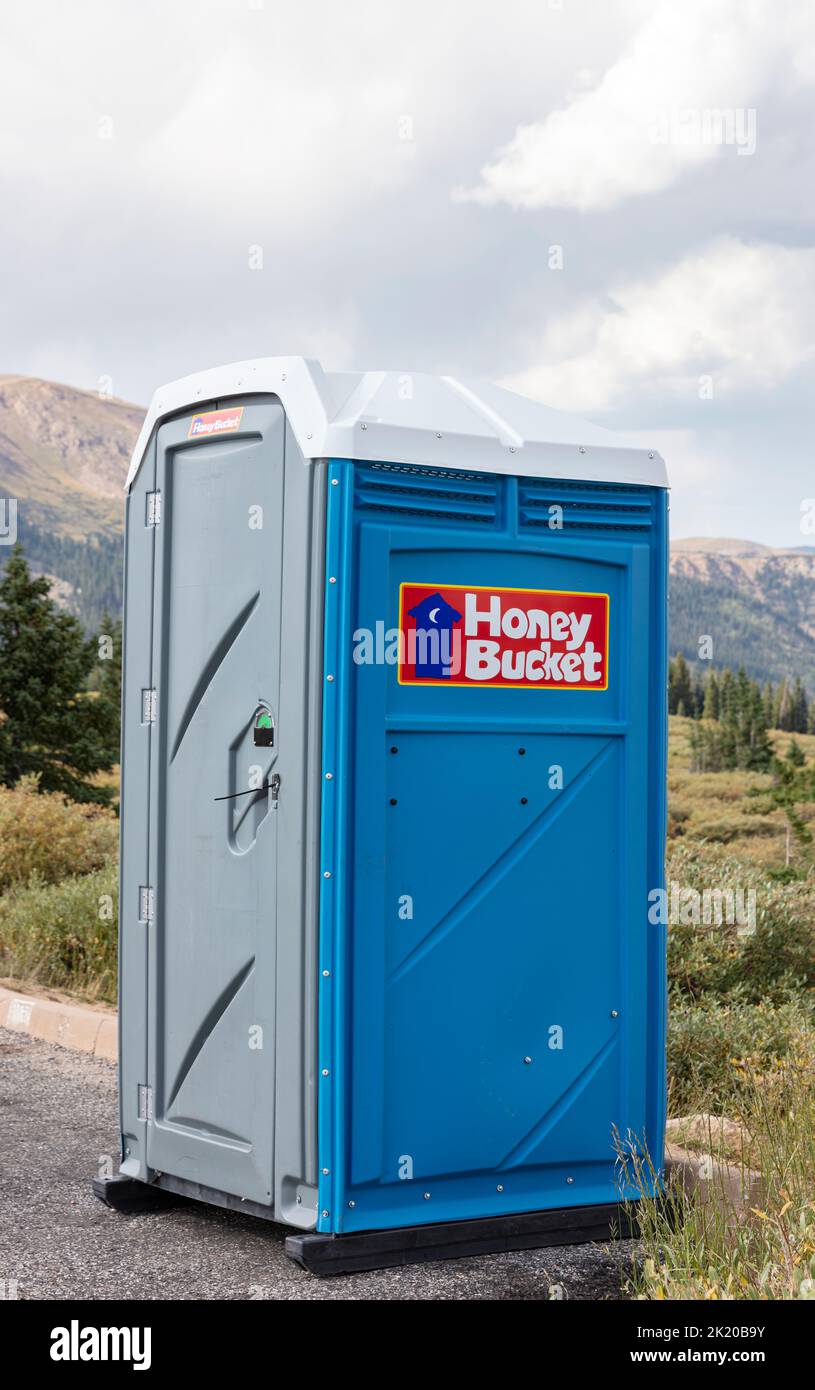 Porta-potty, Honey Bucket in parking area, Colorado Stock Photo