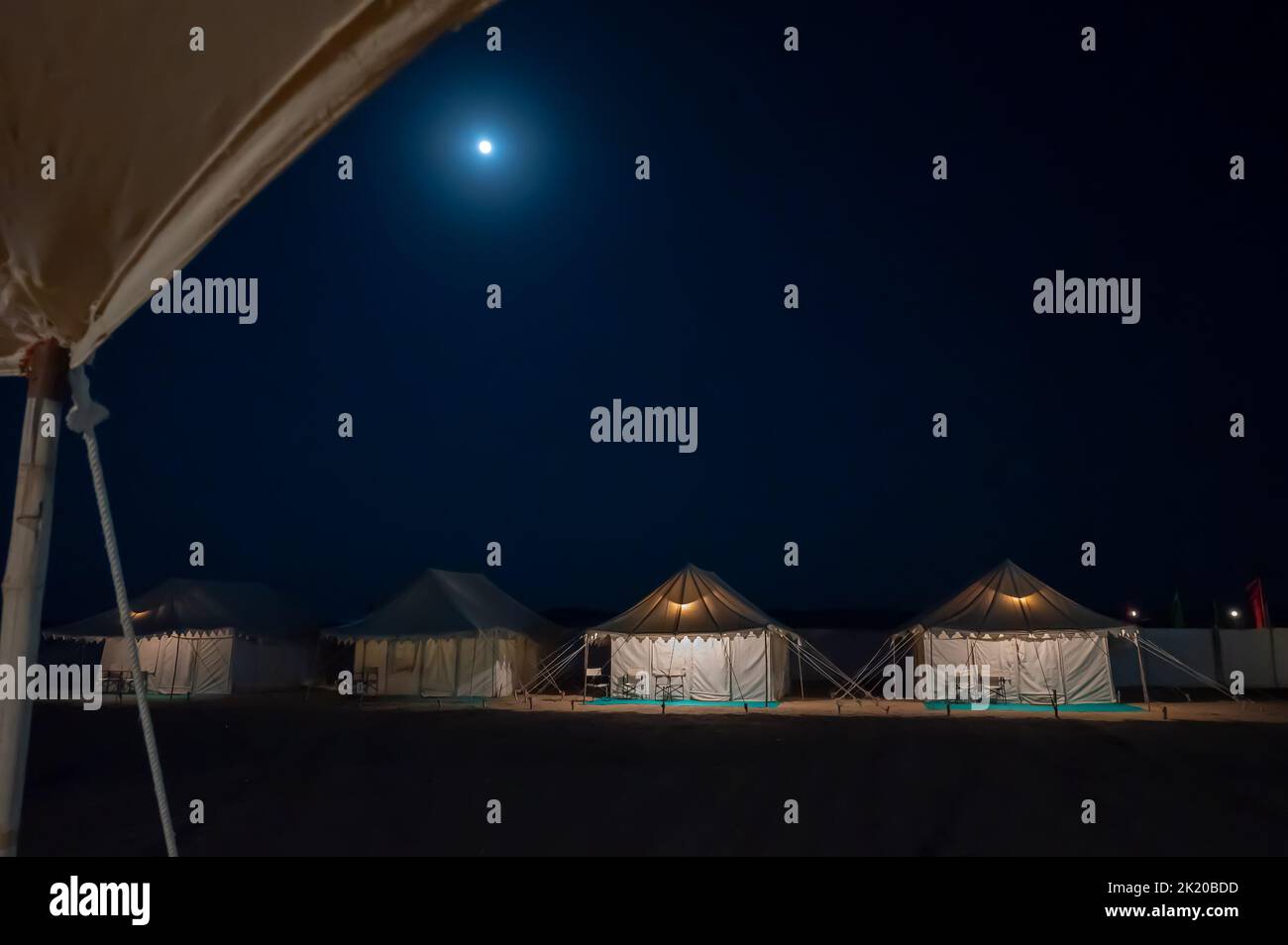 Thar desert, Rajasthan, India - October 15th 2019 : Moon rise behind desert camps at Thar desert. Stock Photo