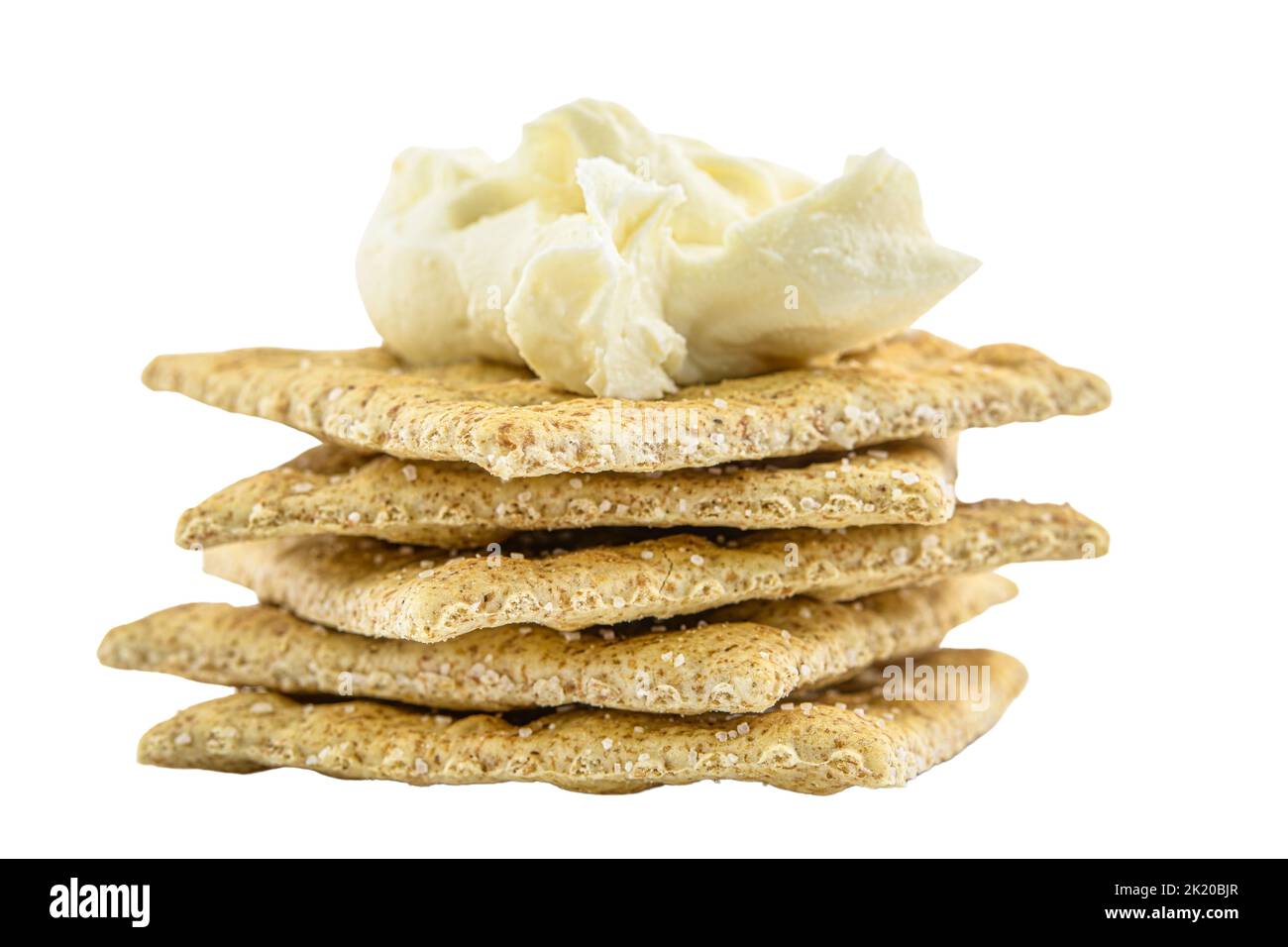 Salty soda cracker with cream cheese isolated in white Stock Photo Alamy