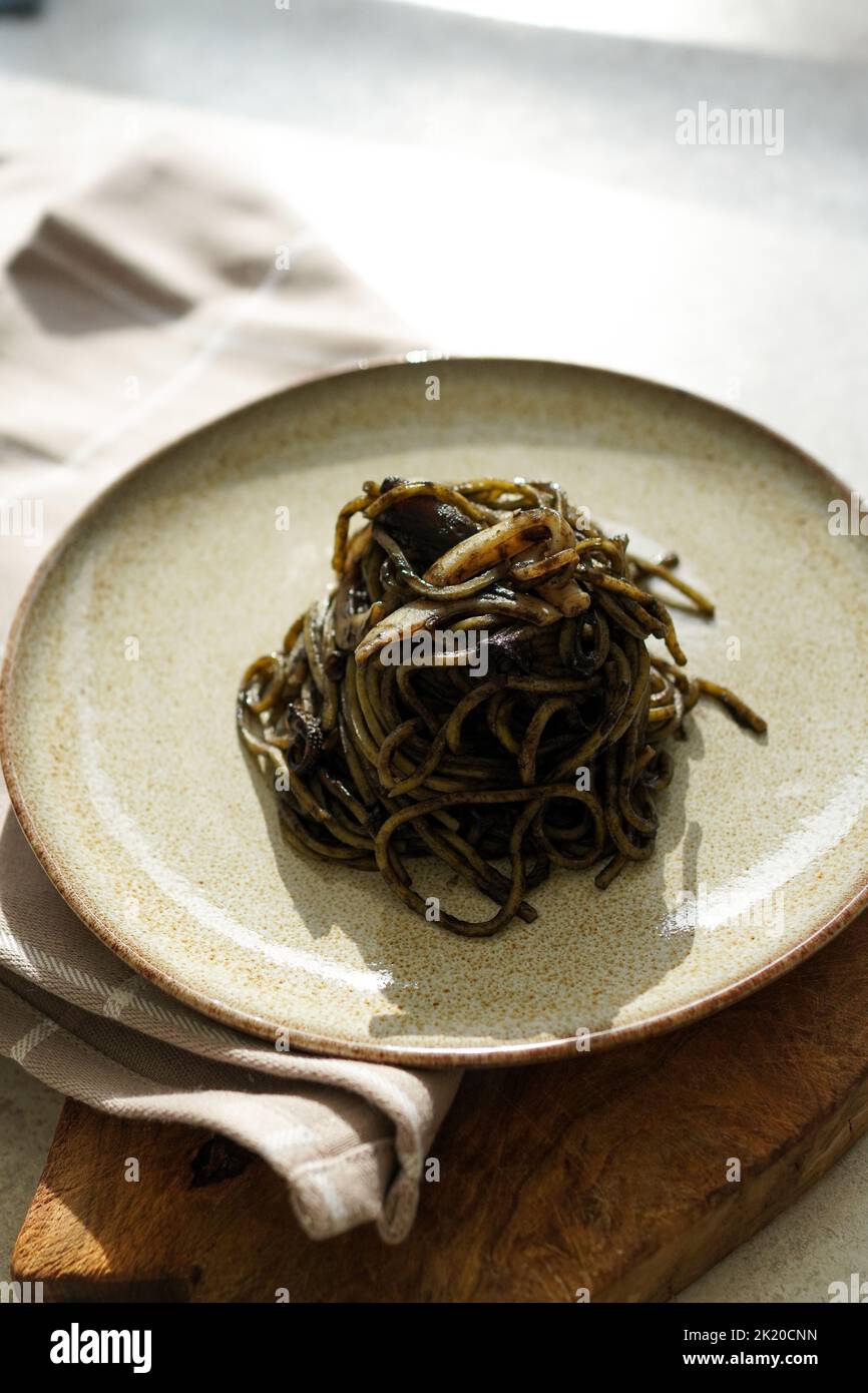 Spaghetti with squid ink (spaghetti al nero di seppia) Stock Photo