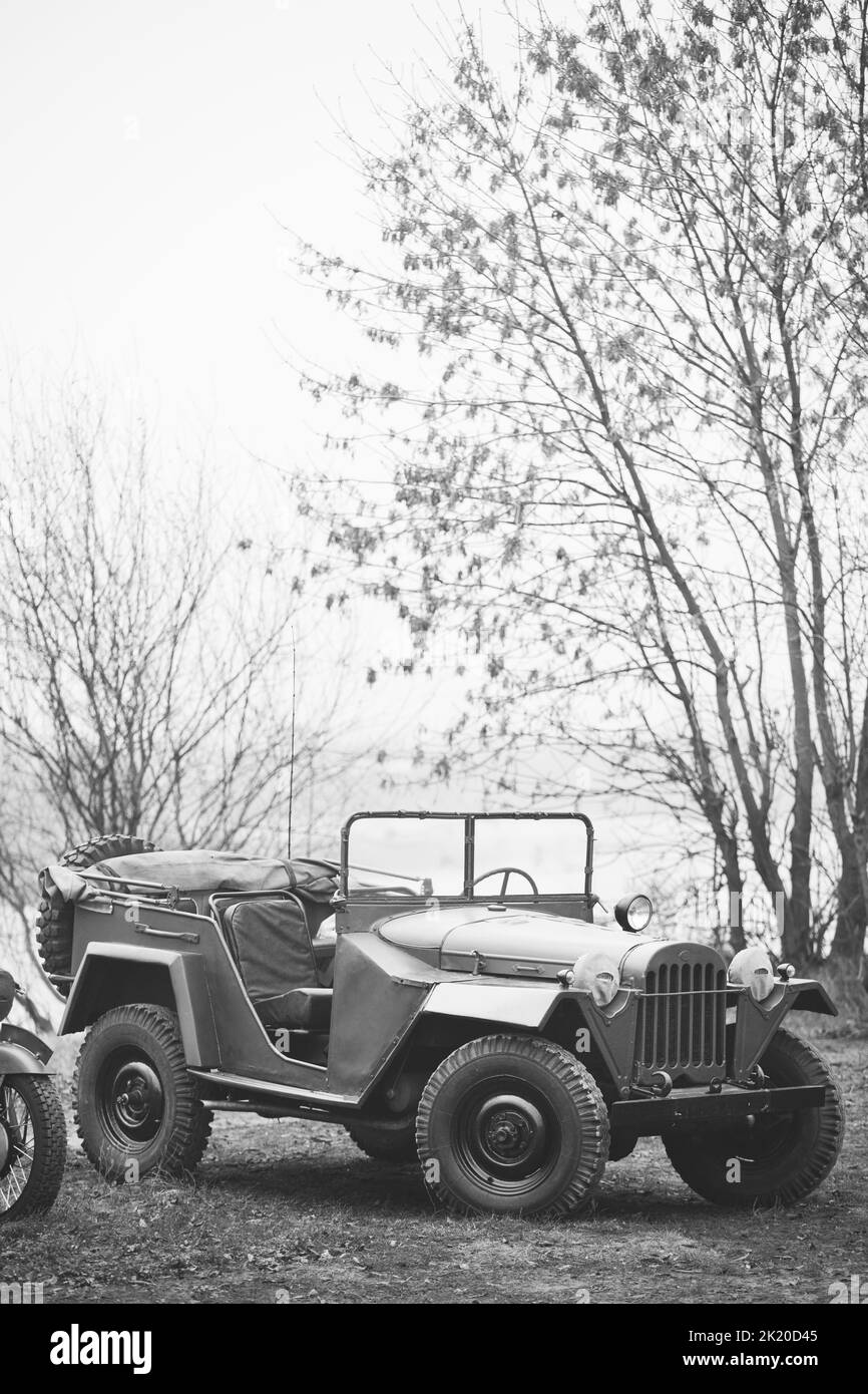 Willys Mb jeep, U.s. Army Truck, 4x4 Of Us Army Forces Of World War 2 Time Standing Parked At Forest During Reconstruction Of Some Fight World War II Stock Photo