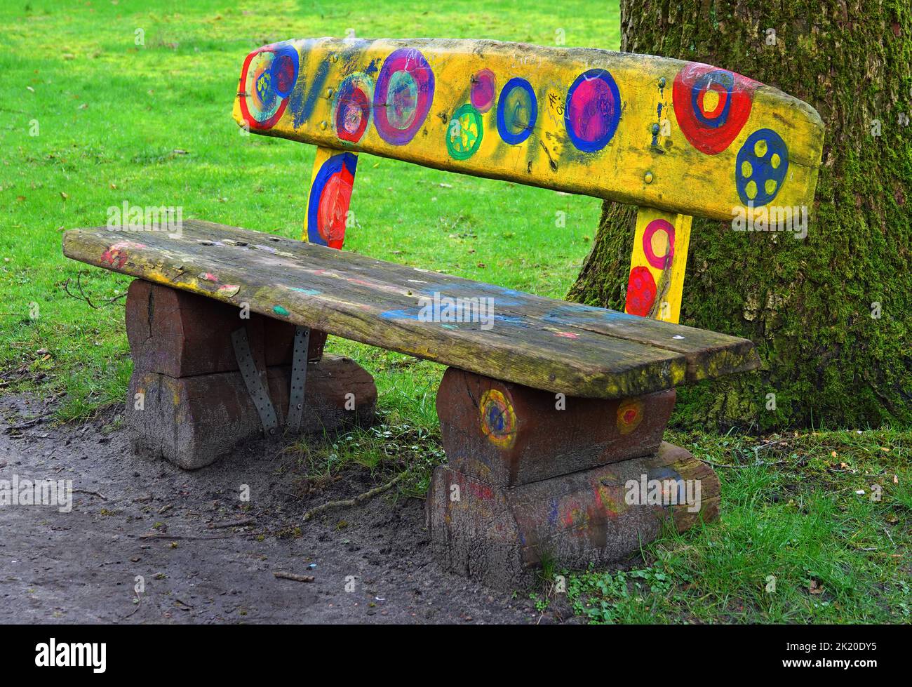 Lingen, Germany - Feb 8 2022  A romantic bench  in an public park in Lingen. It seems to be painted by children Stock Photo