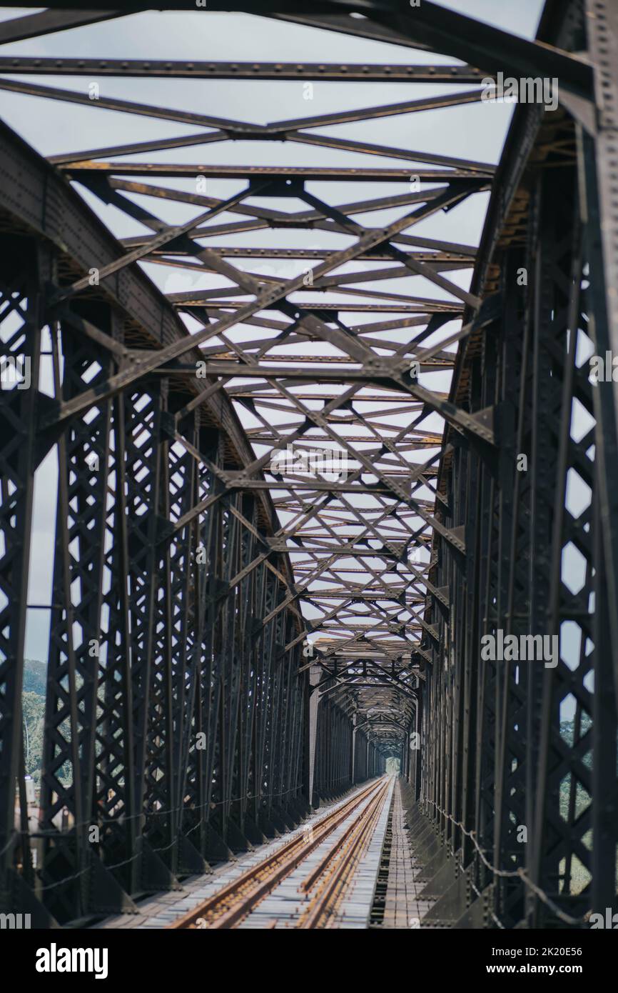 A tall steel bridge with a railway over the river Stock Photo Alamy