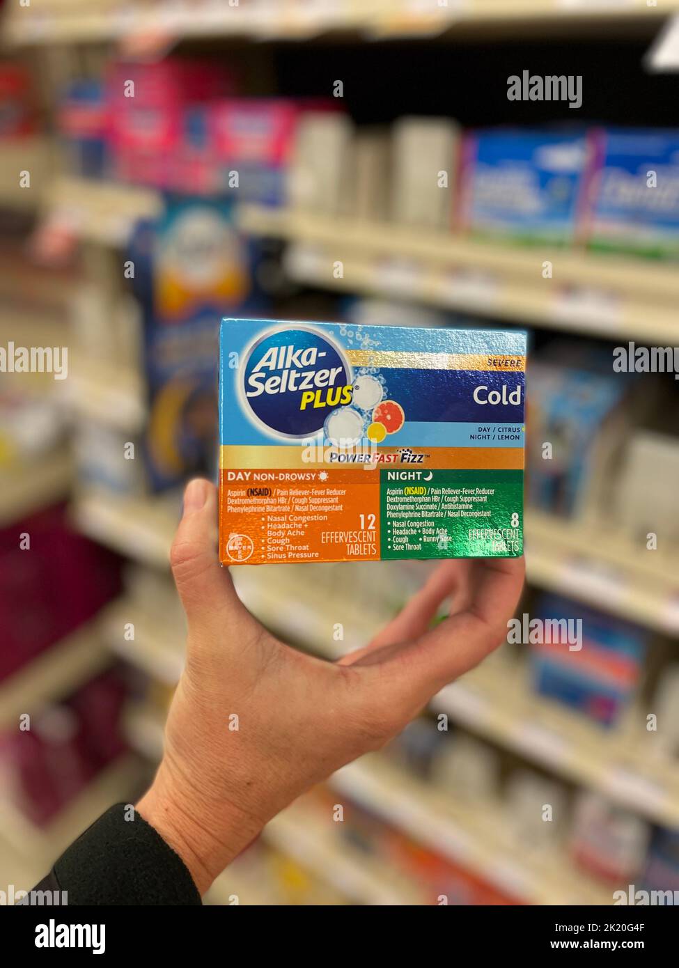 Grovetown, Ga USA - 09 21 22: Grocery store medicine section hand holding Alka-seltzer plus Stock Photo