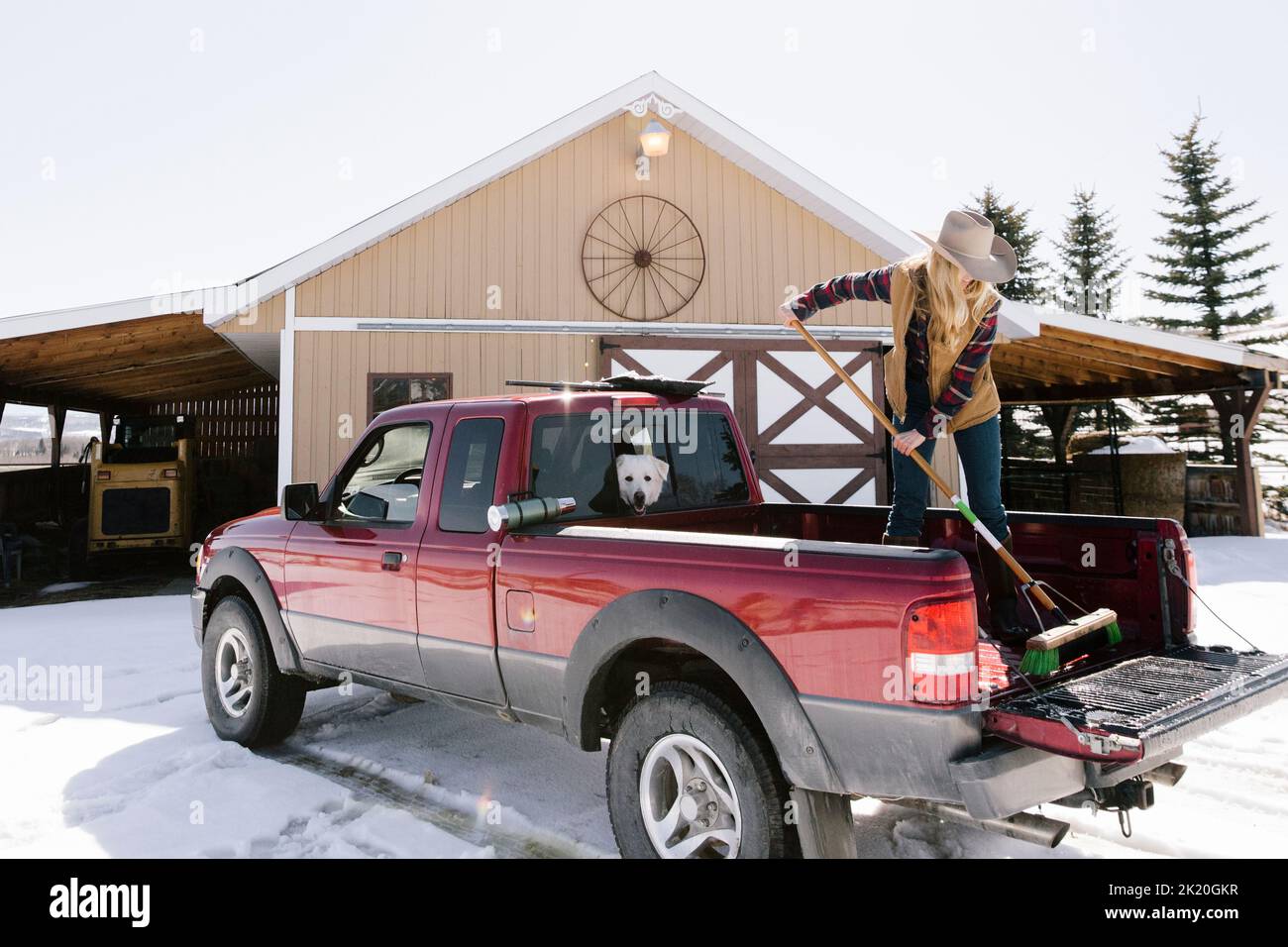 Woman sweeping in barn hires stock photography and images Alamy