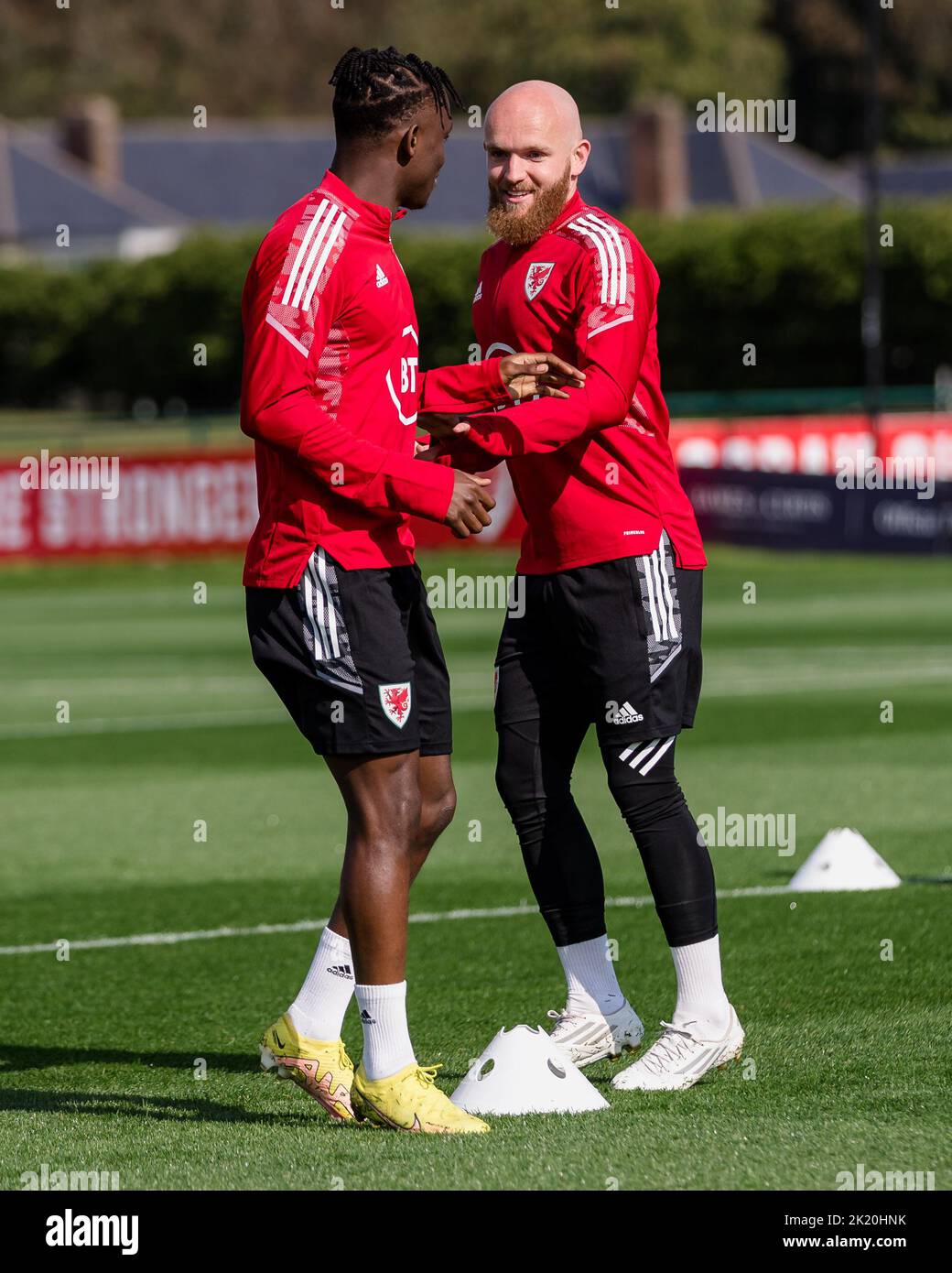 PONTYCLUN, WALES - 21 SEPTEMBER 2022: Wales' Rabbi Matondo and Wales' Jonny Williams  during a training session at the vale resort ahead of the league Stock Photo