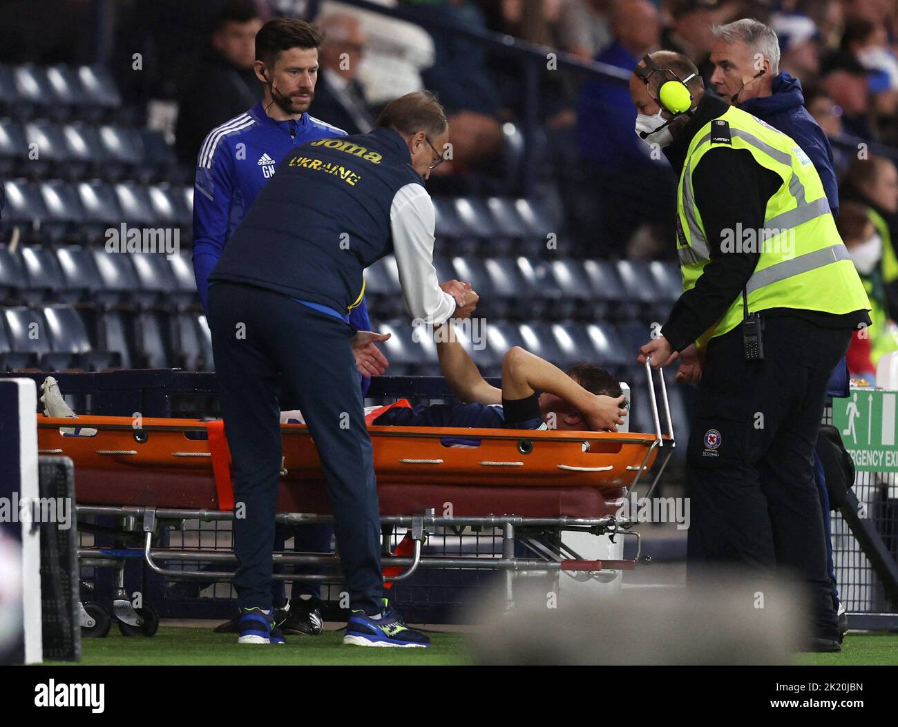 Soccer Football - UEFA Nations League - Group E - Scotland v Ukraine - Hampden Park, Glasgow, Scotland, Britain - September 21, 2022 Scotland's Nathan Patterson is stretchered off after sustaining an injury REUTERS/Russell Cheyne Stock Photo